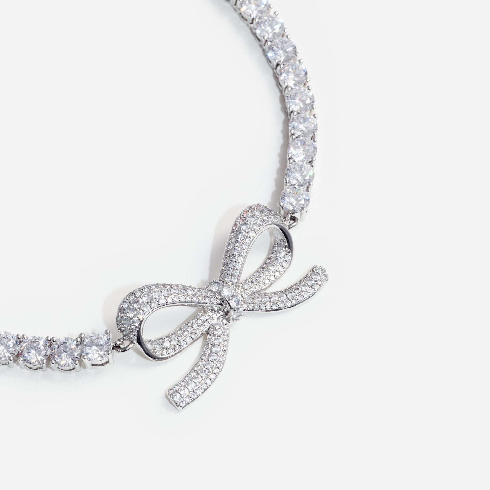 Side view of a woman wearing the Diamante Bow Tennis Choker