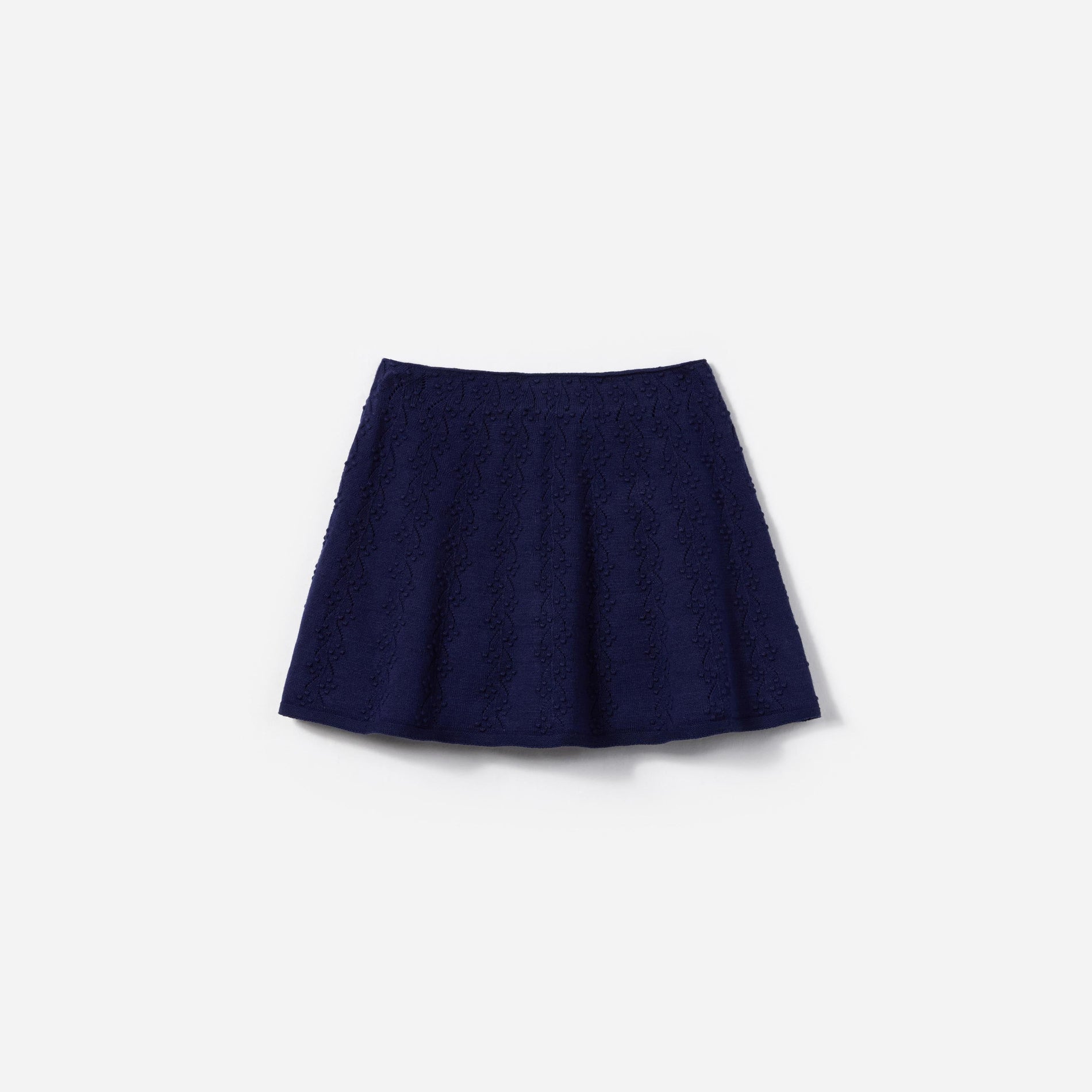 Side view of a woman wearing the Navy Textured Knit Skirt