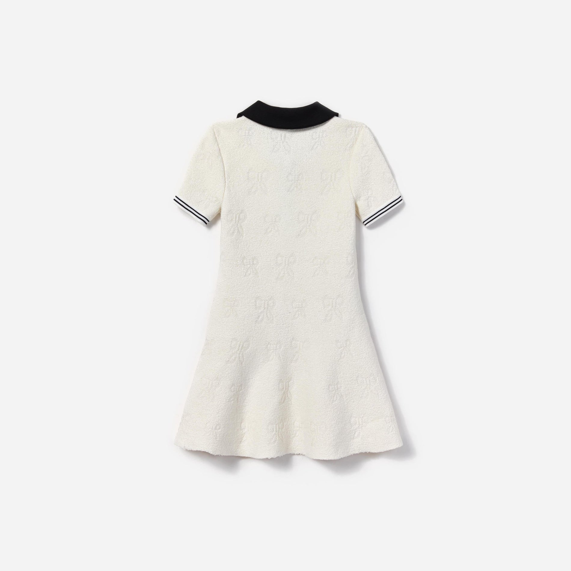 Side view of a woman wearing the White Jacquard Knit Dress