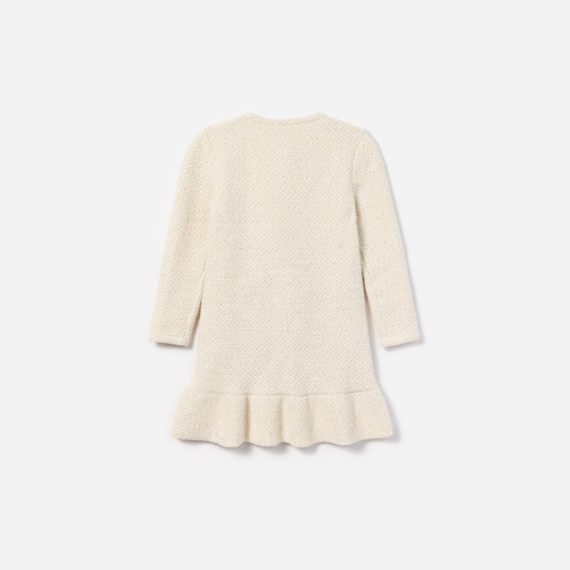 Side view of a woman wearing the Cream Sequin Knit Dress