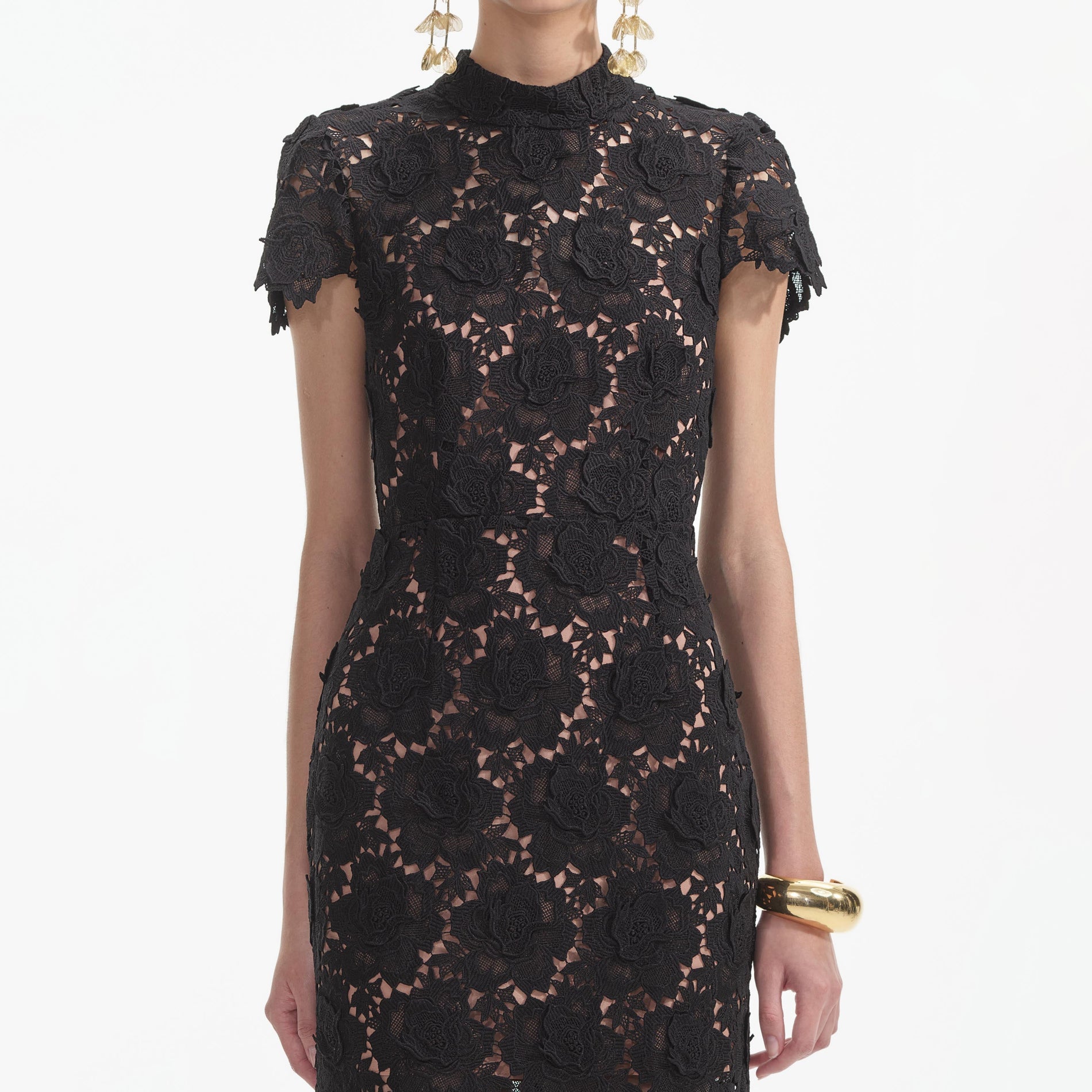 A close up of a woman wearing the Black Flower Lace Midi Dress