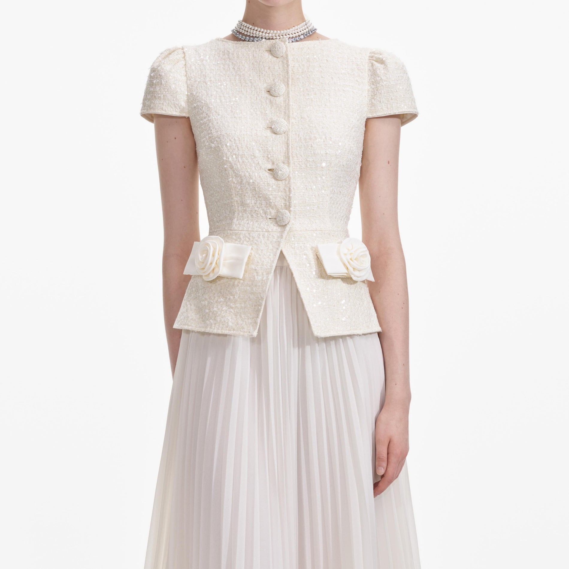 A close up of a woman wearing the Cream Boucle Bow Detail Midi Dress