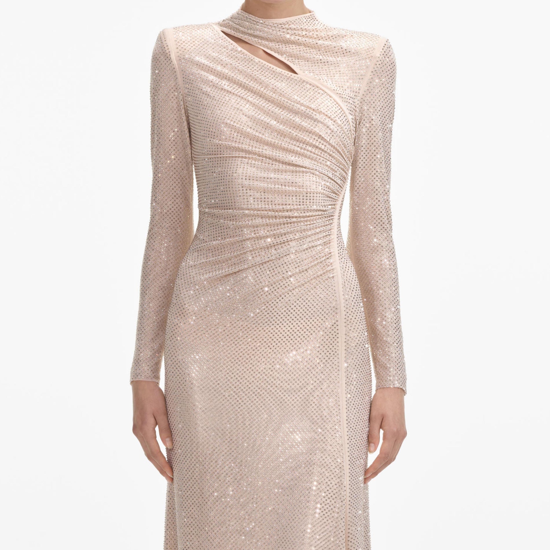 A close up of a woman wearing the Gold Rhinestone Mesh Cut Out Maxi Dress