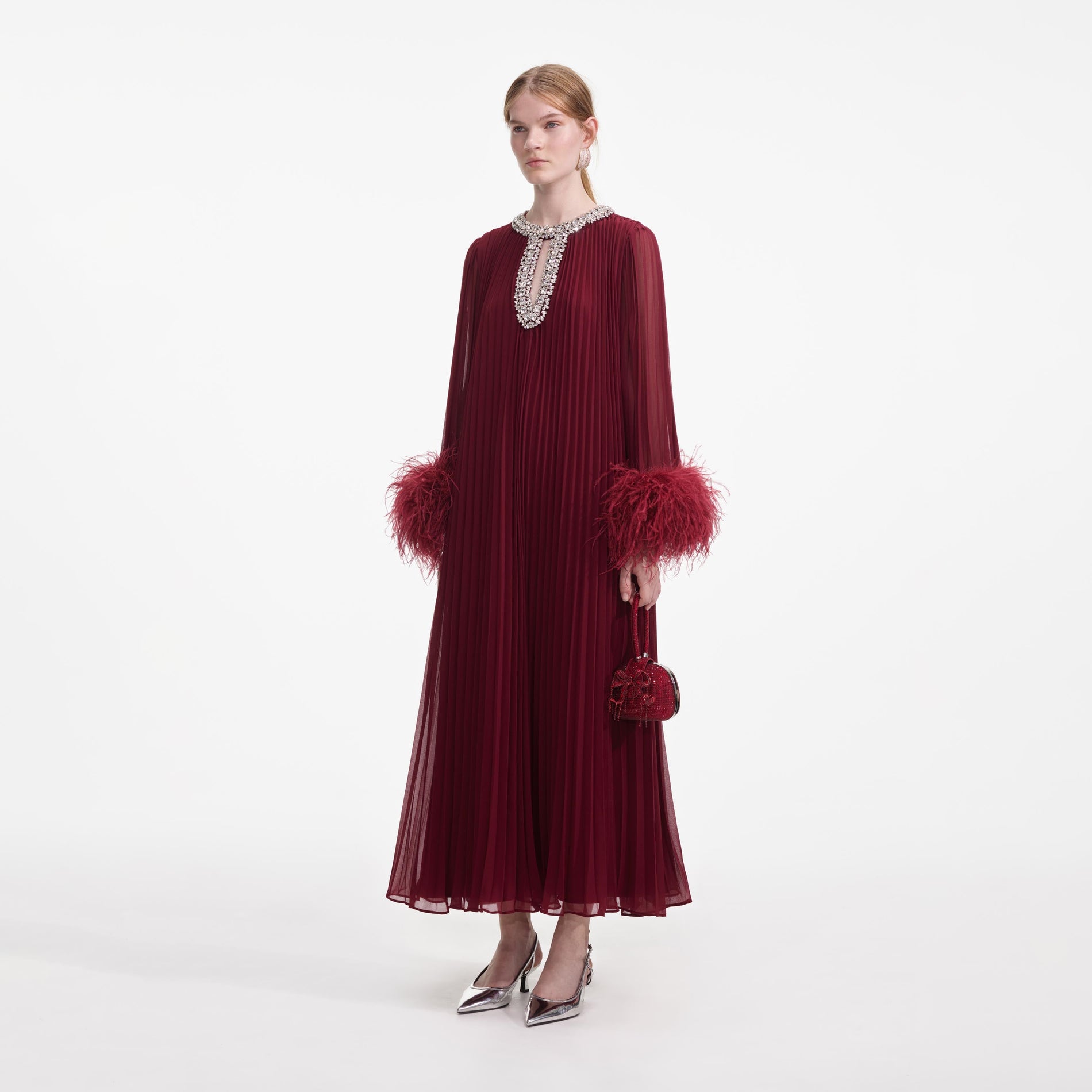 Side view of a woman wearing the Burgundy Chiffon Feather Midi Dress