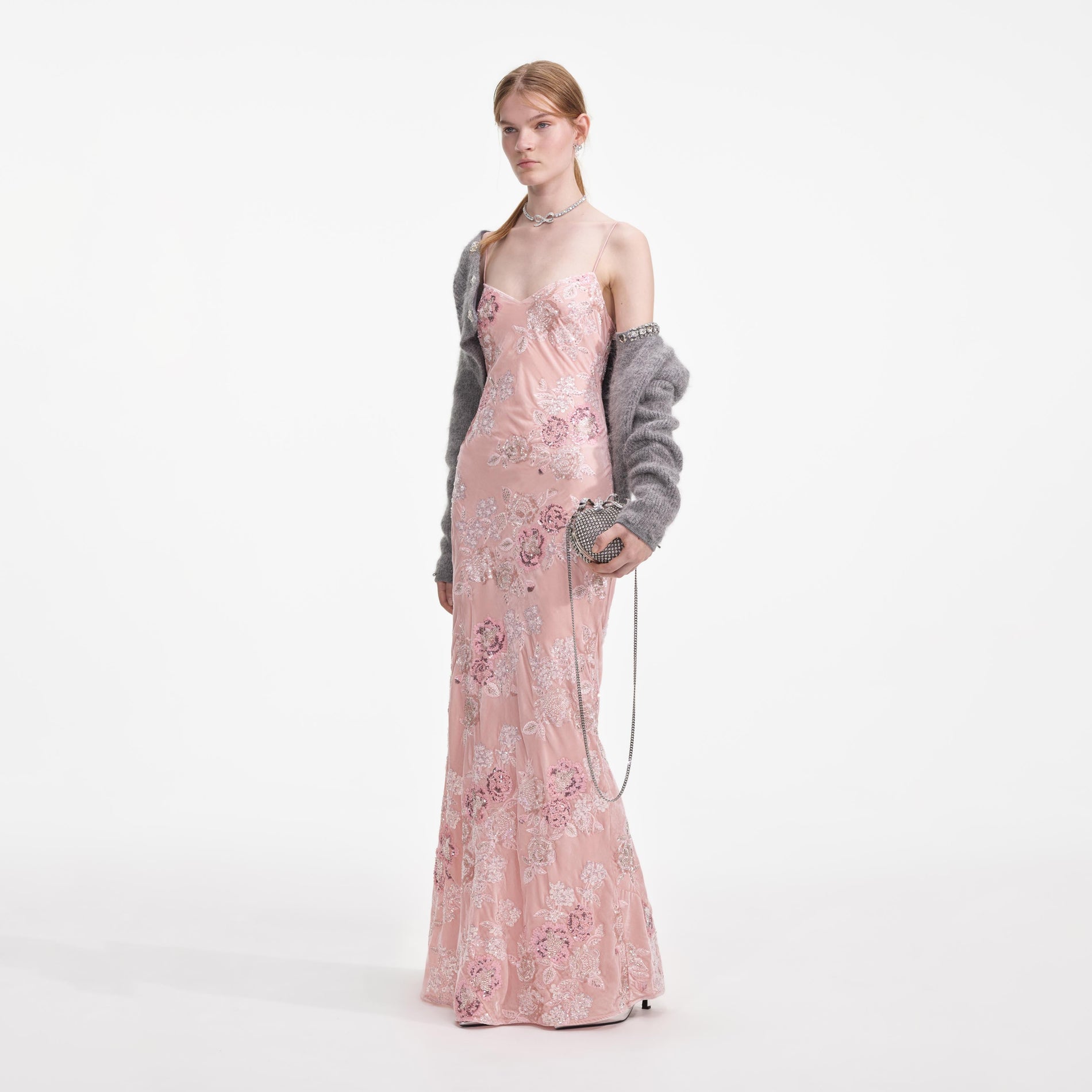 Side view of a woman wearing the Pink Embellished Velvet Maxi Dress