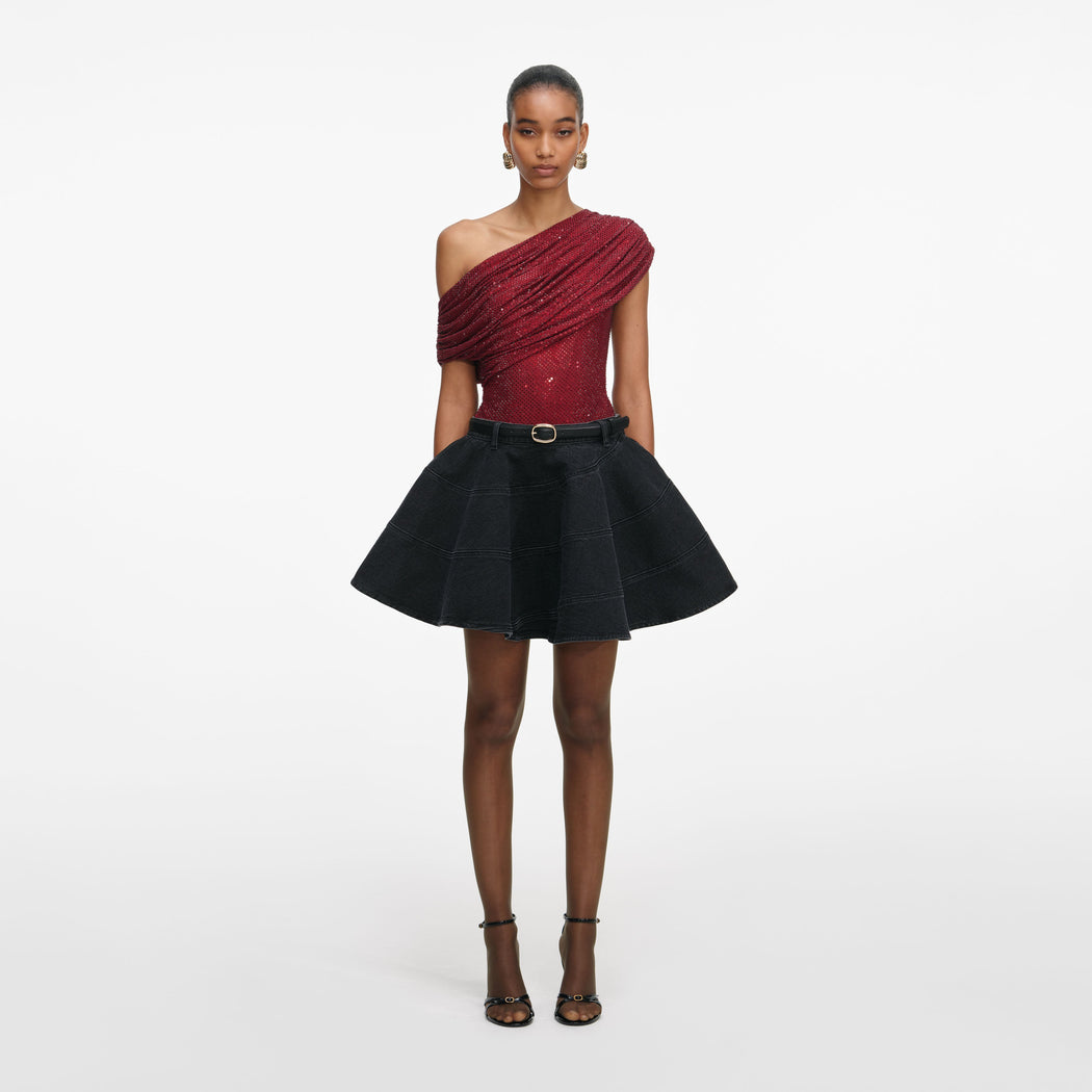 Front view of a woman wearing the Burgundy Rhinestone Drape Top