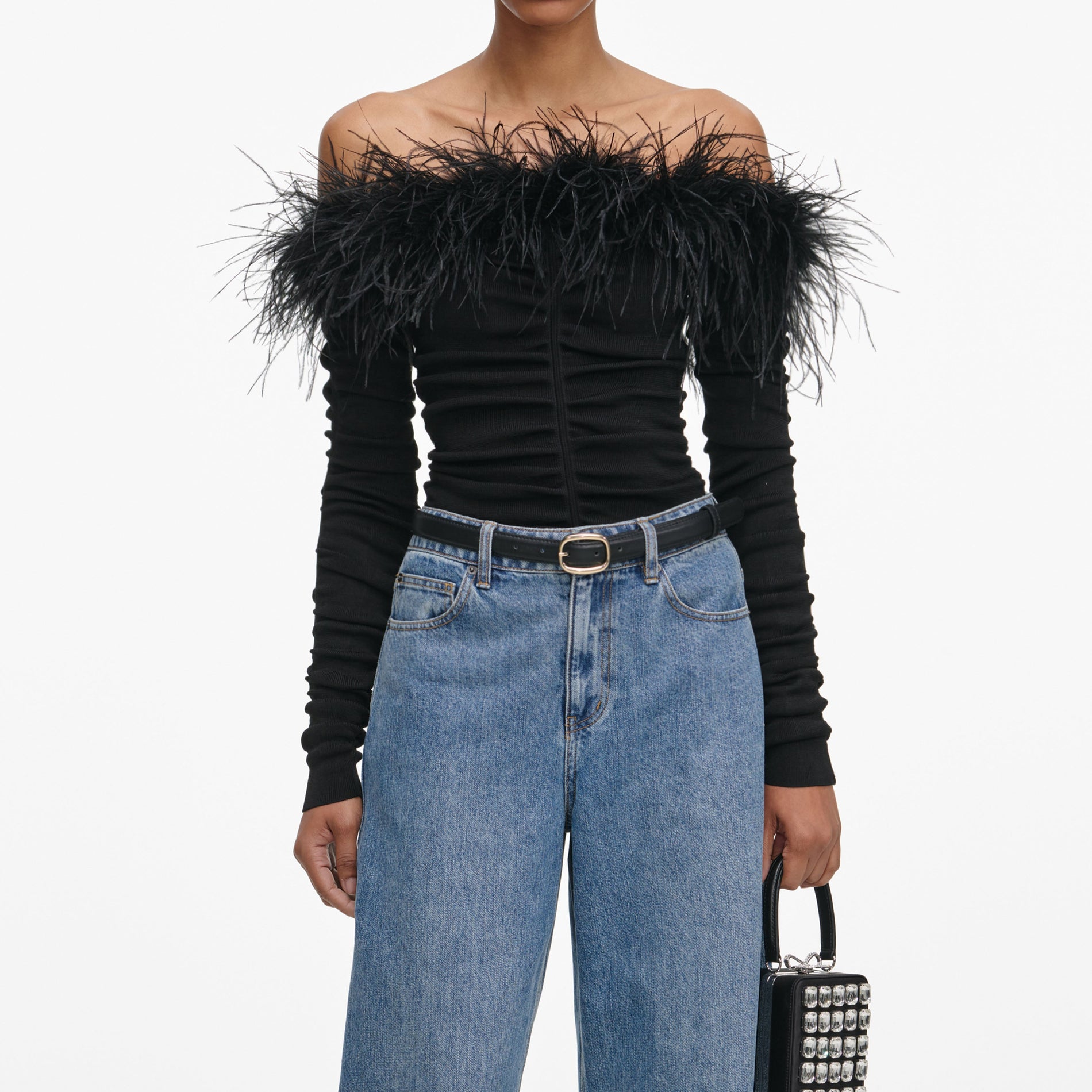 A close up of a woman wearing the Black Feather Viscose Knit Top