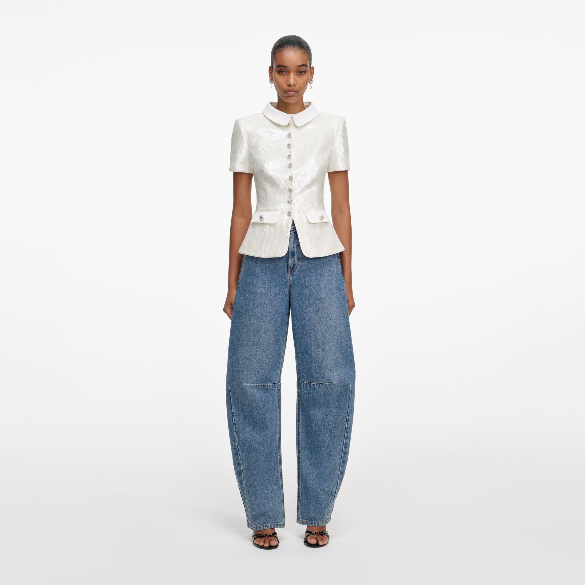 Front view of a woman wearing the White Sequin Tailored Top