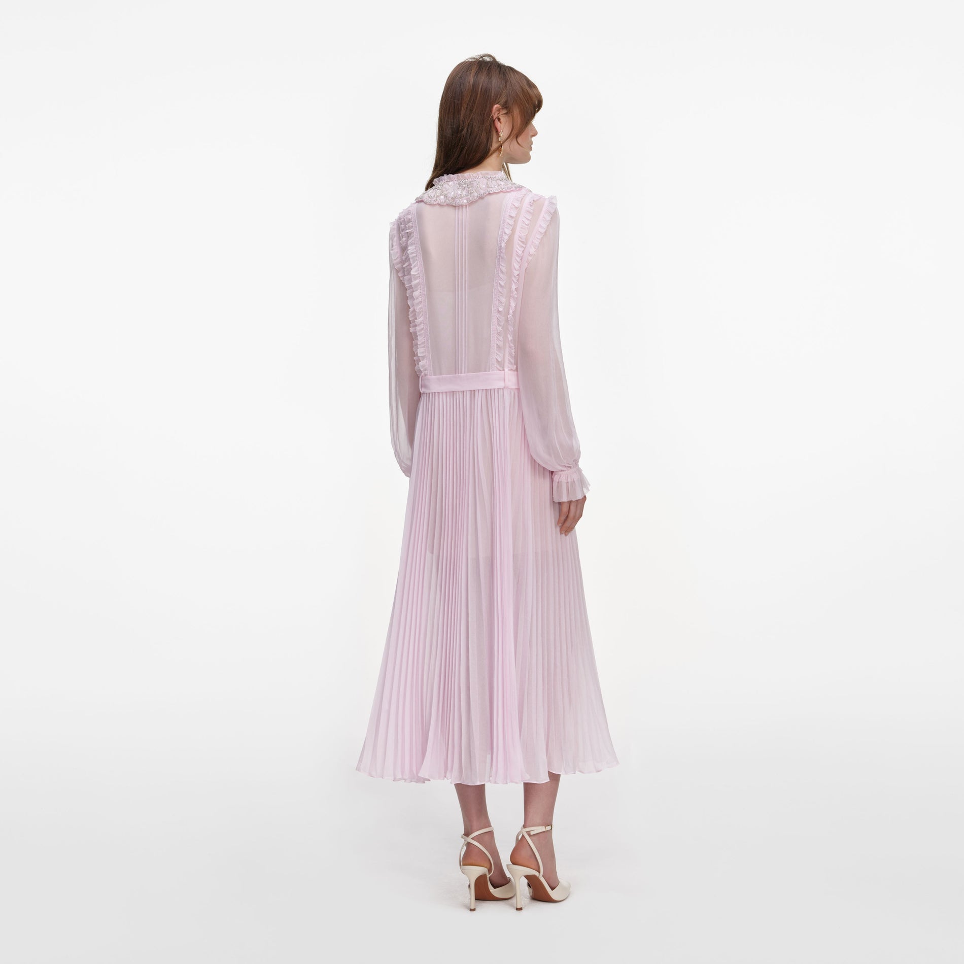 Back view of a woman wearing the Pink Pleated Georgette Midi Dress