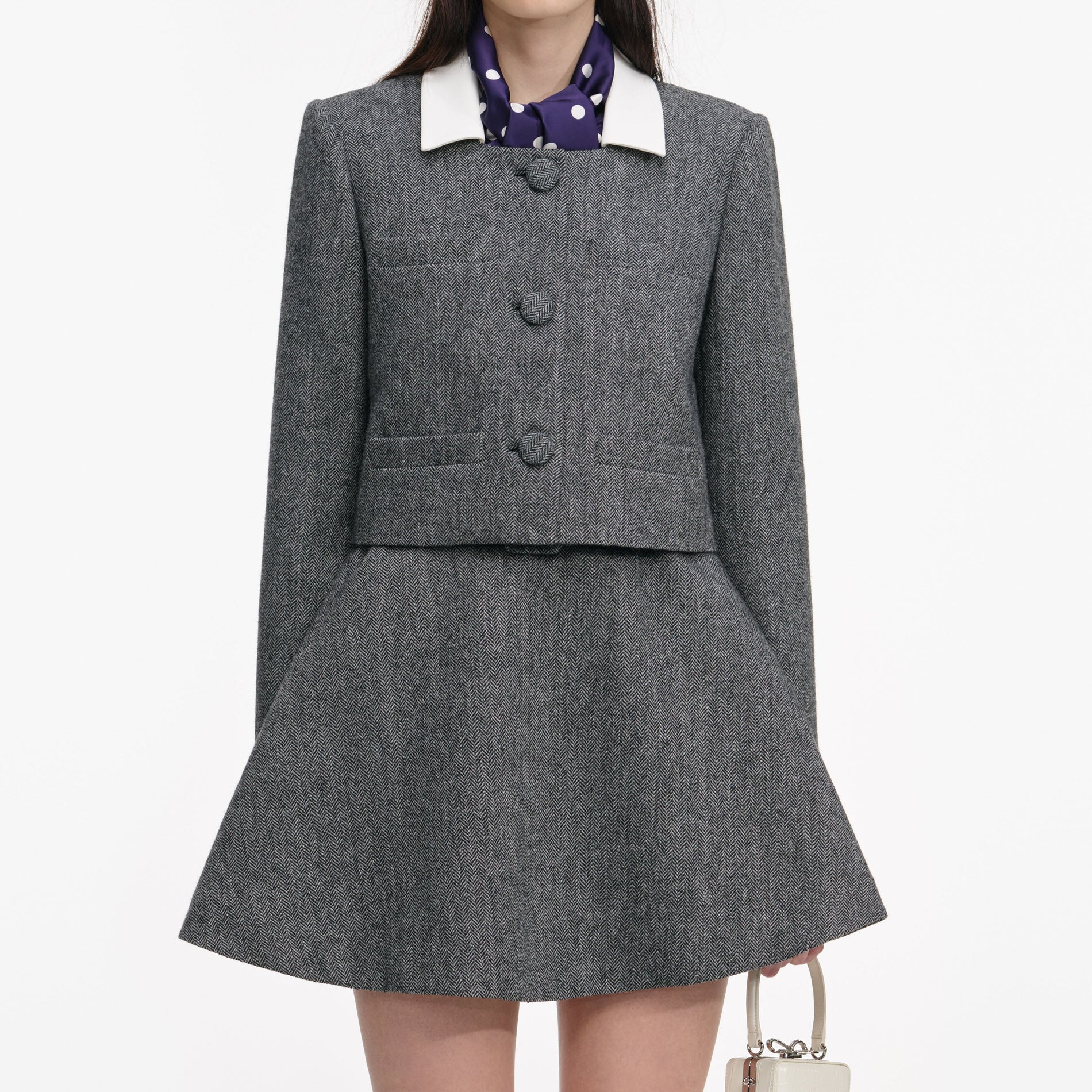 Side view of a woman wearing the Grey Herringbone Scarf Detail Jacket