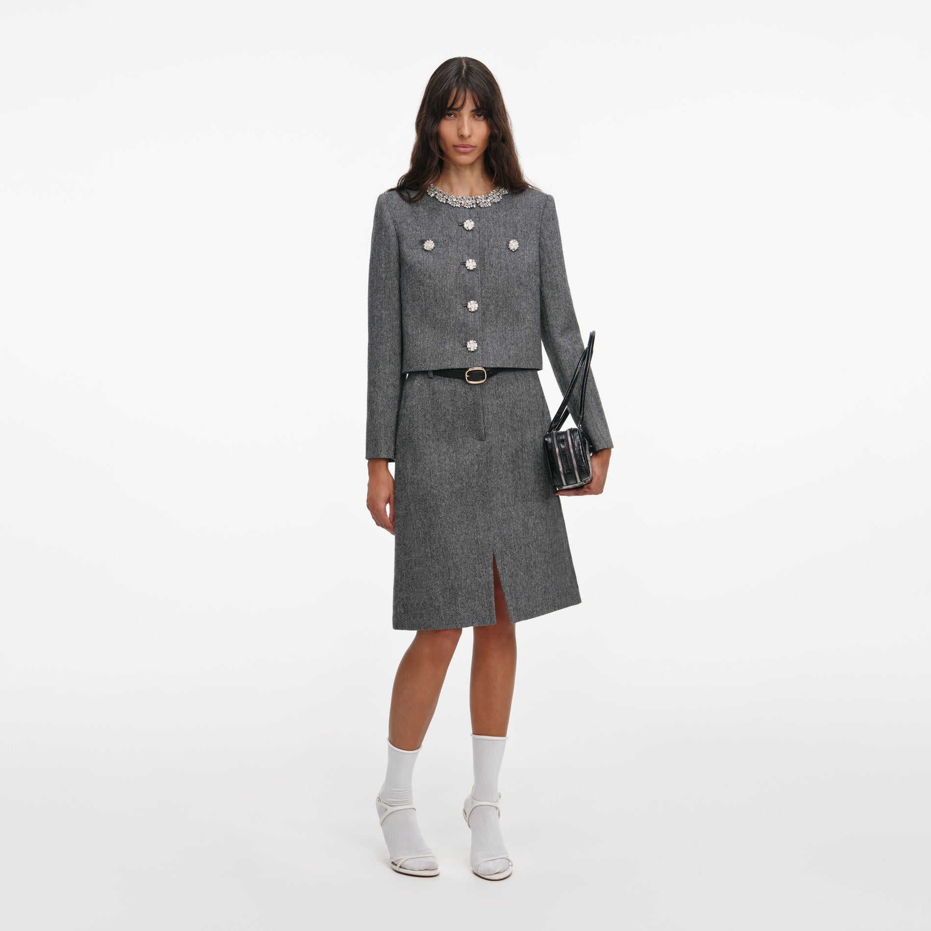 Front view of a woman wearing the Grey Herringbone Crystal Trim Jacket