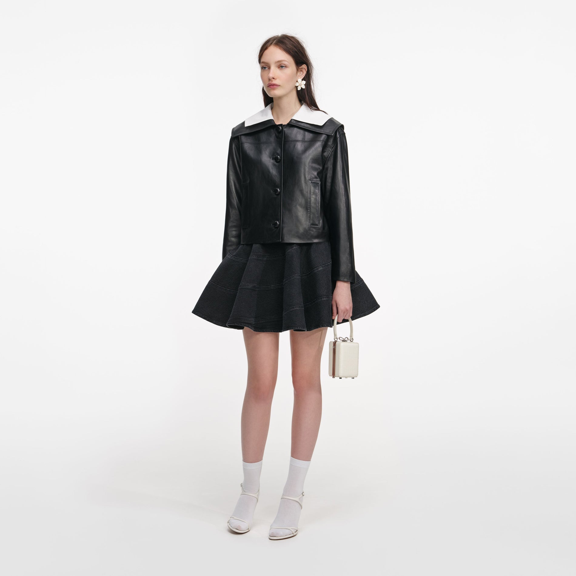 Side view of a woman wearing the Black Leather Contrast Collar Jacket