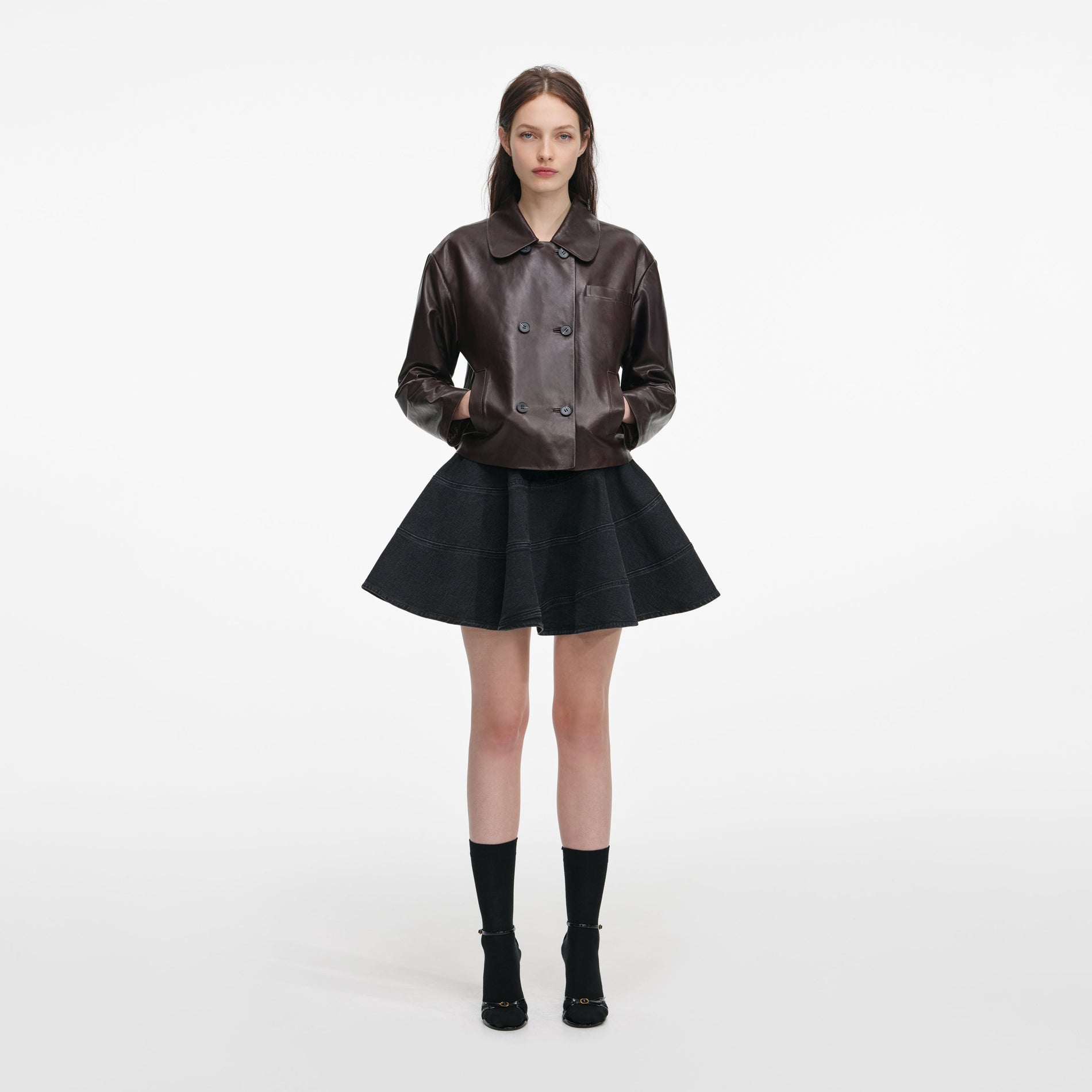 Front view of a woman wearing the Brown Cropped Leather Jacket