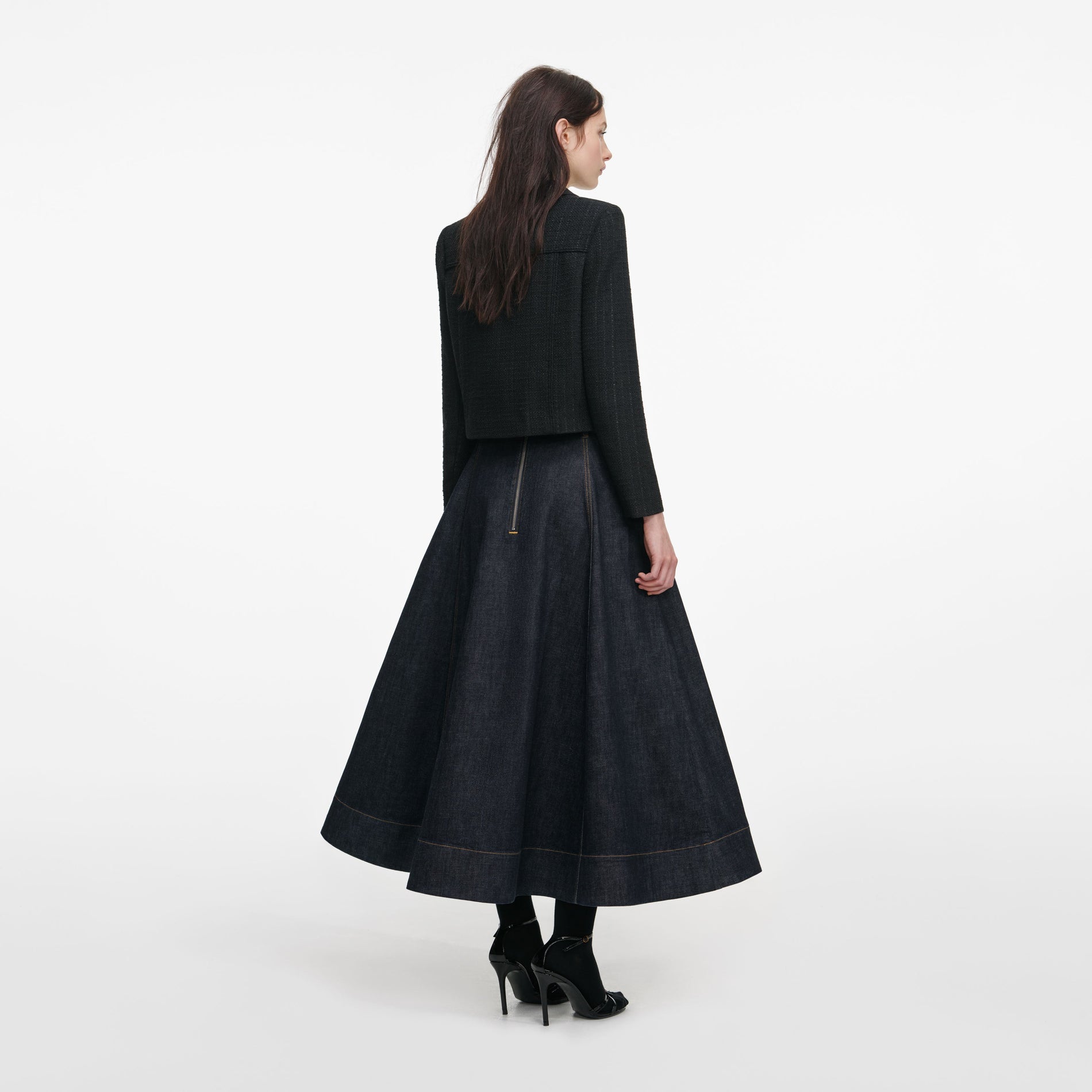 Back view of a woman wearing the Black Boucle Cropped Jacket
