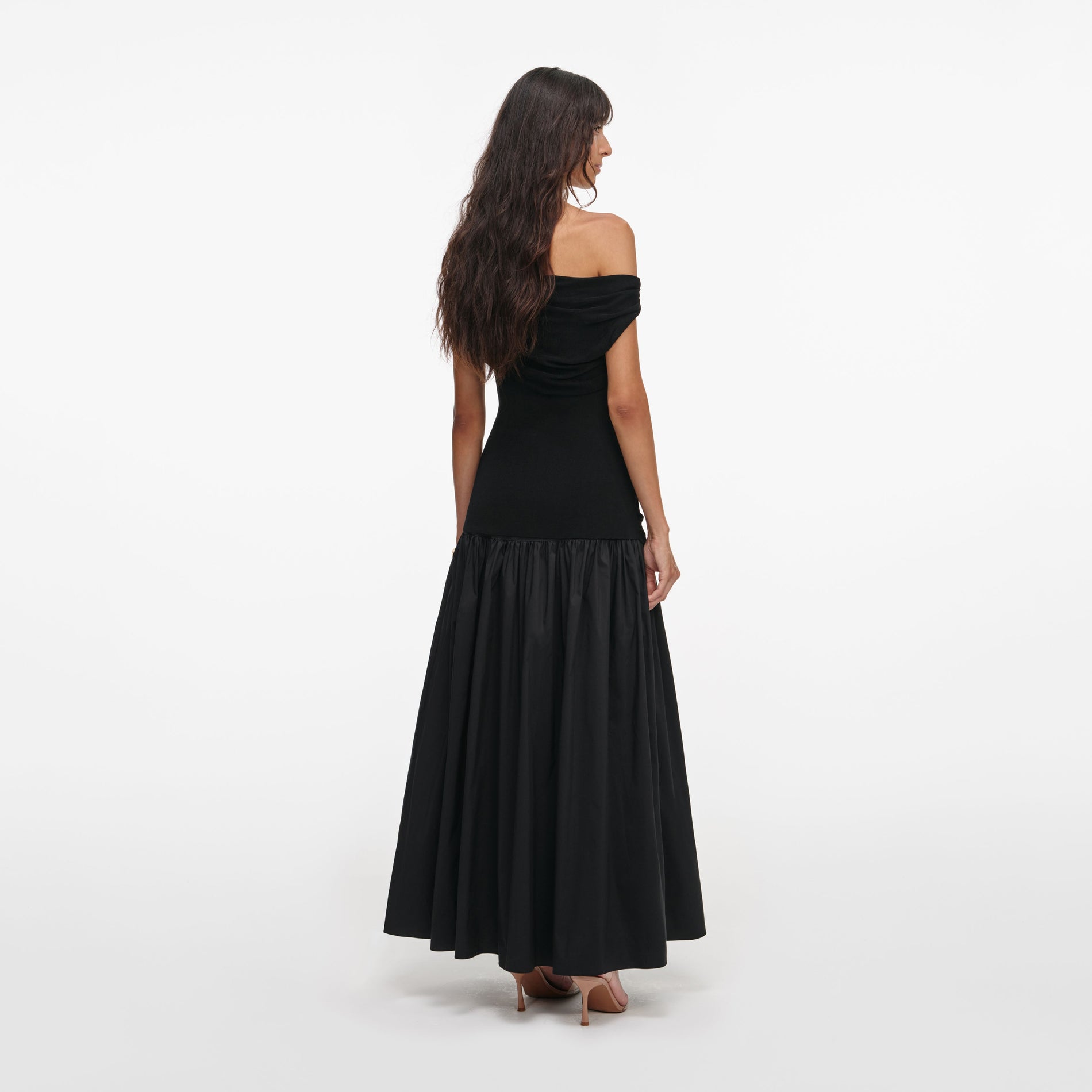 Back view of a woman wearing the Black Cotton Draped Knit Midi Dress