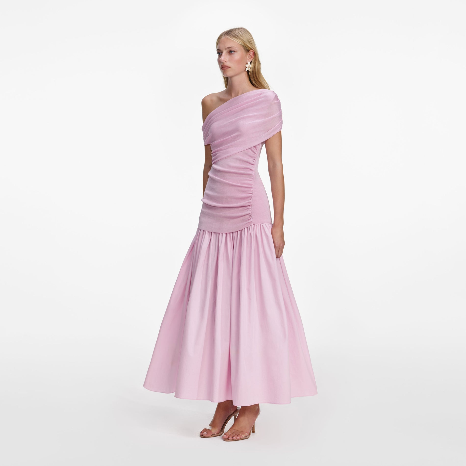 Side view of a woman wearing the Pink Cotton Draped Knit Midi Dress