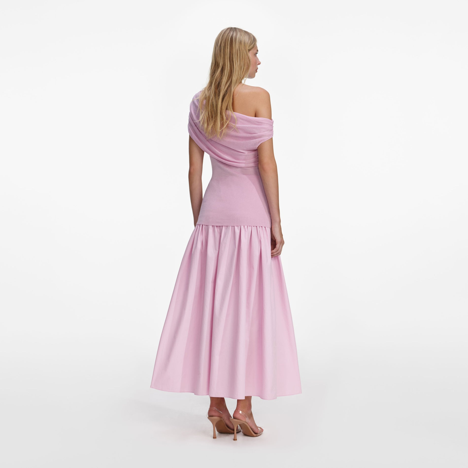 Back view of a woman wearing the Pink Cotton Draped Knit Midi Dress