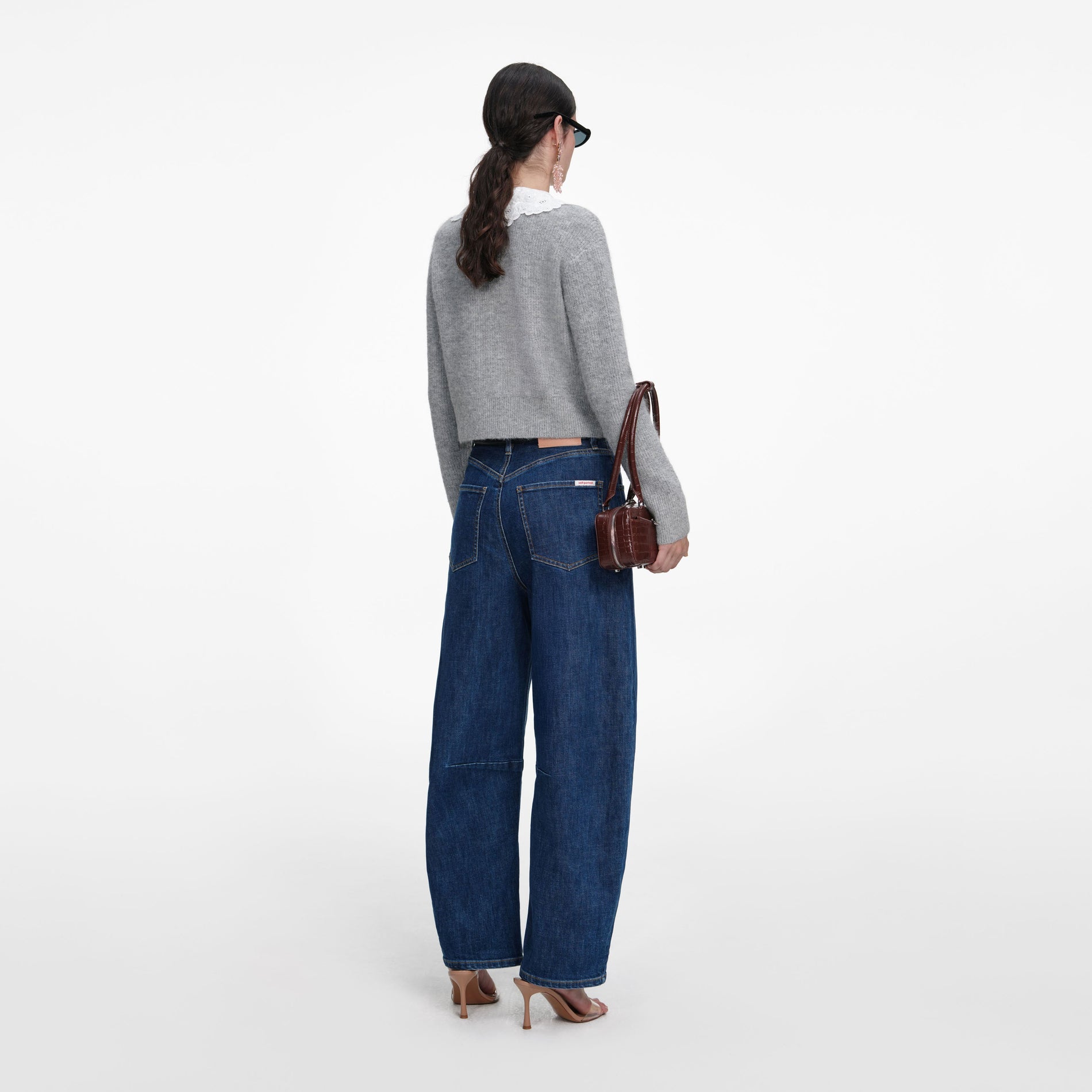 Back view of a woman wearing the Grey Lace Collar Cardigan