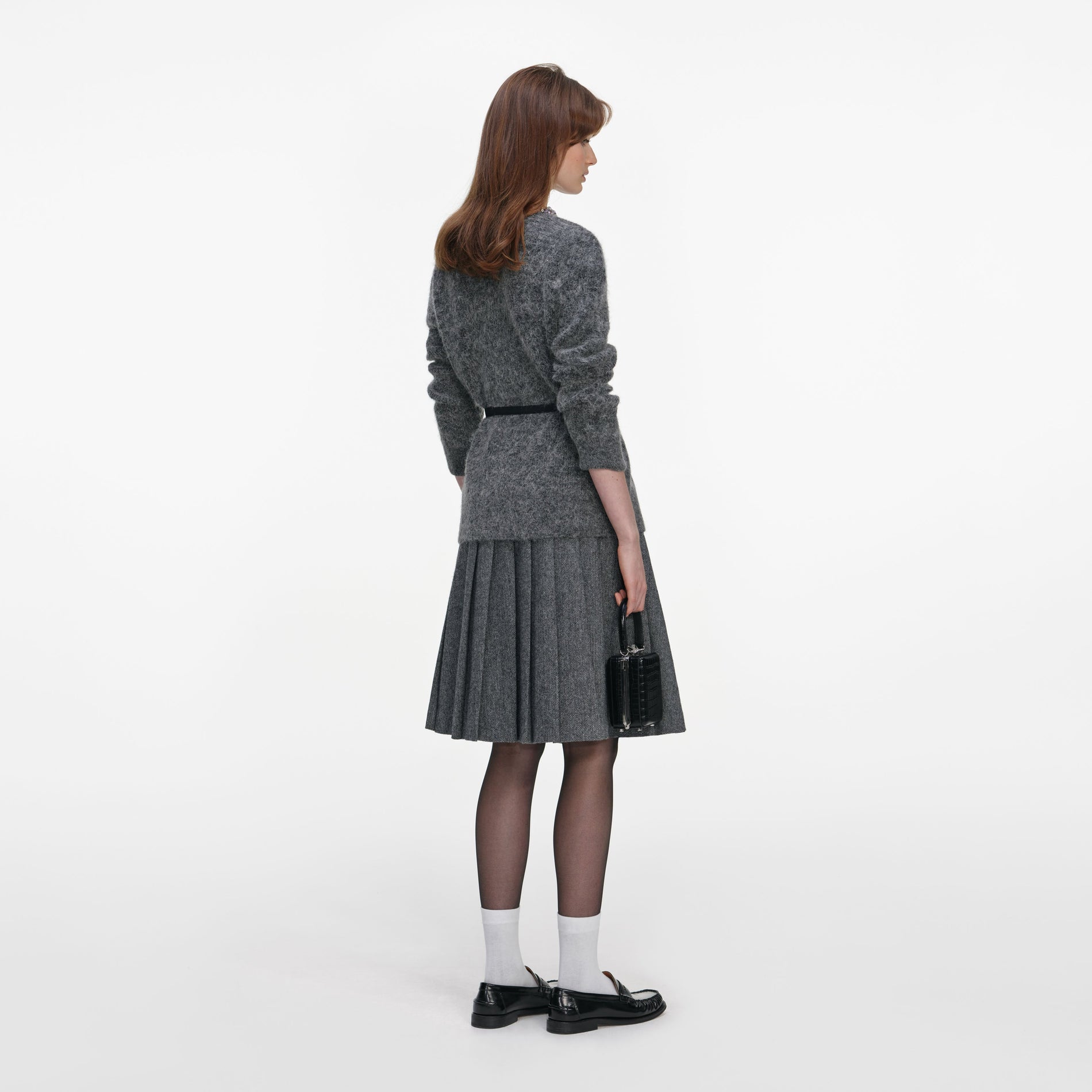 Back view of a woman wearing the Charcoal Crystal Trim Cardigan