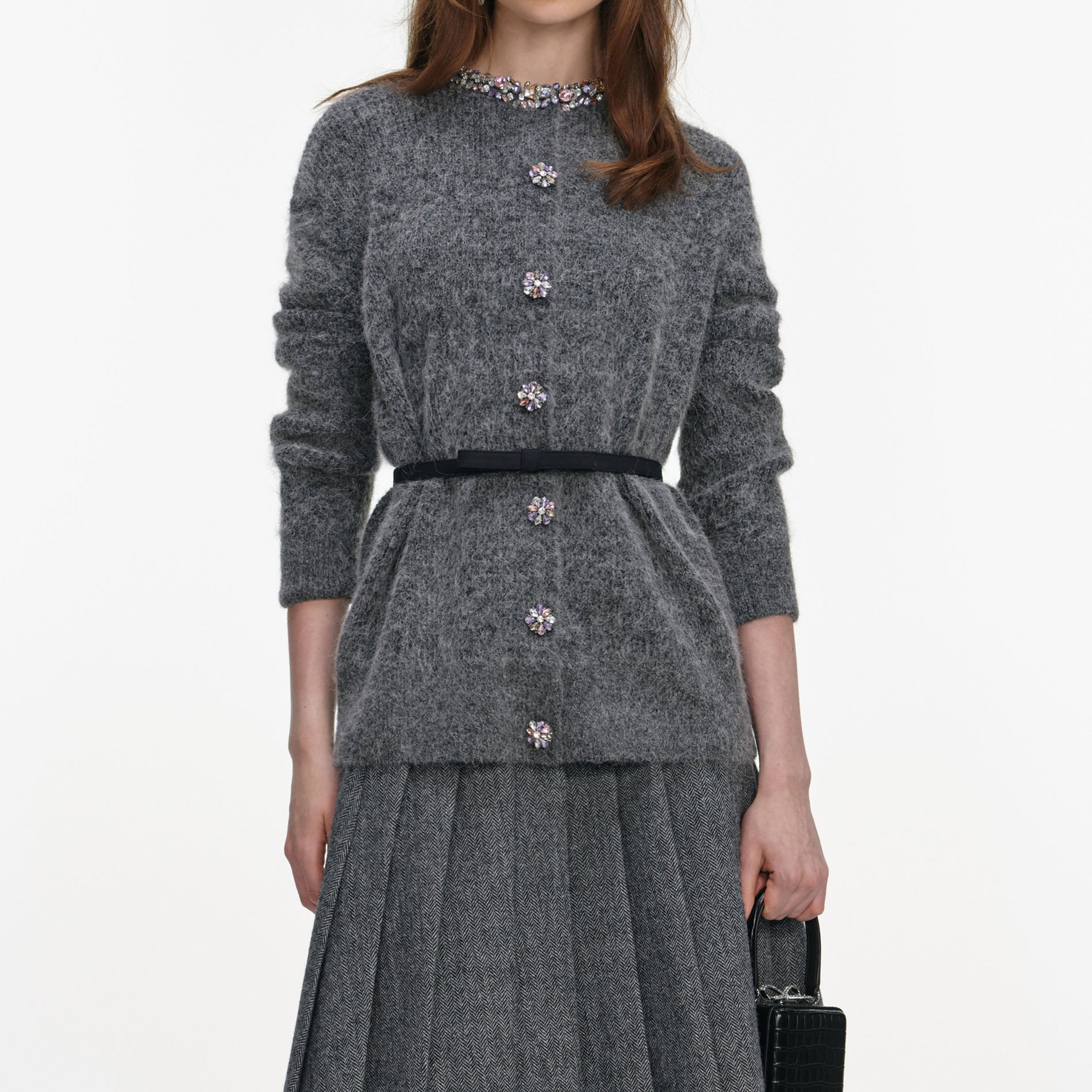 A close up of a woman wearing the Charcoal Crystal Trim Cardigan