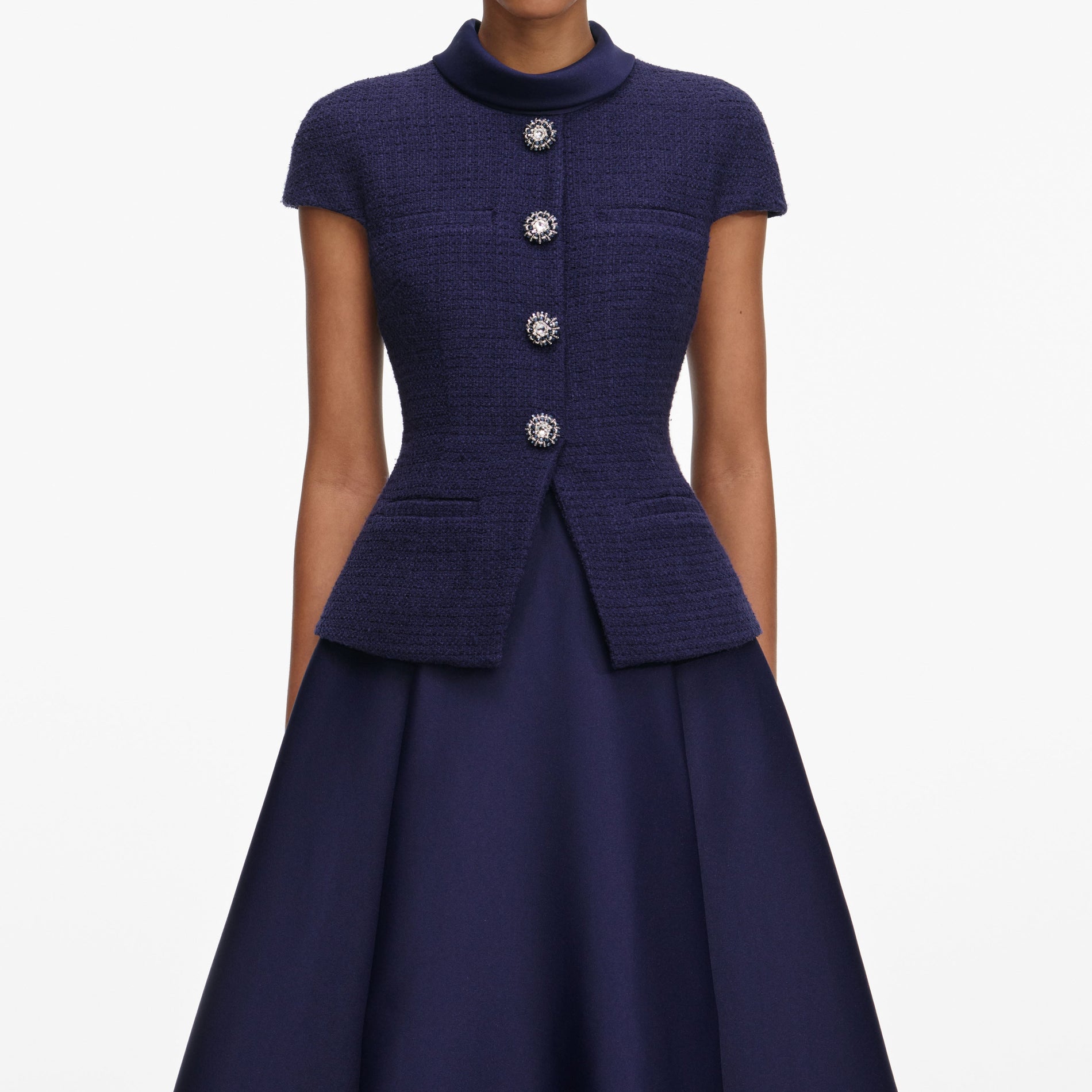 A close up of a woman wearing the Navy Boucle Taffeta Midi Dress