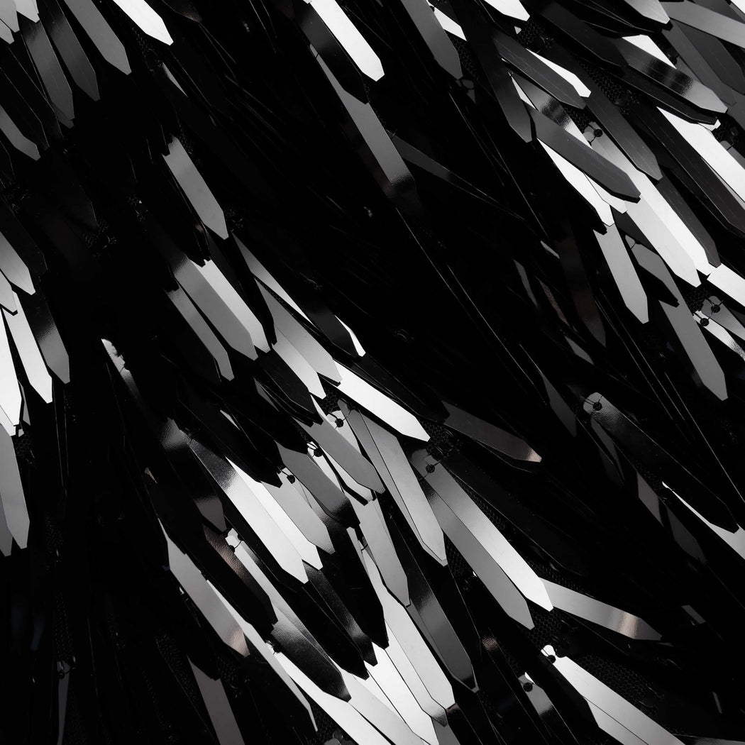 A close up of the fabric for the Black Sequin Top