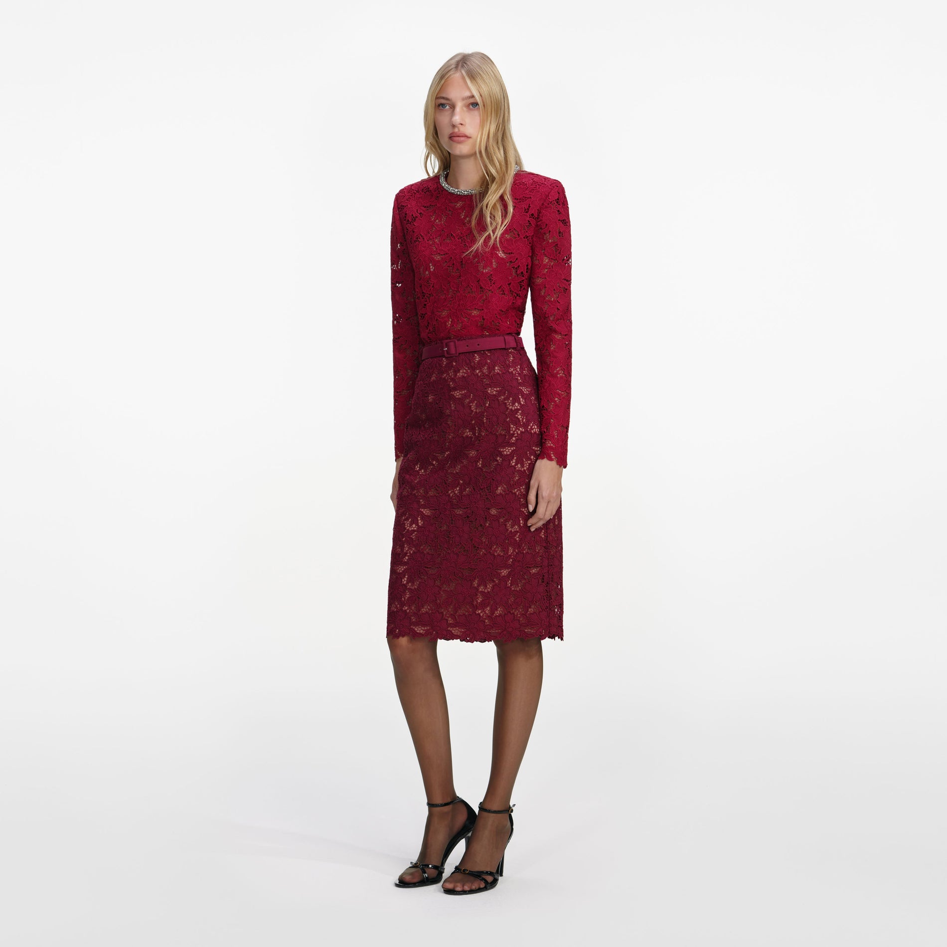 Side view of a woman wearing the Burgundy Guipure Lace Midi Skirt