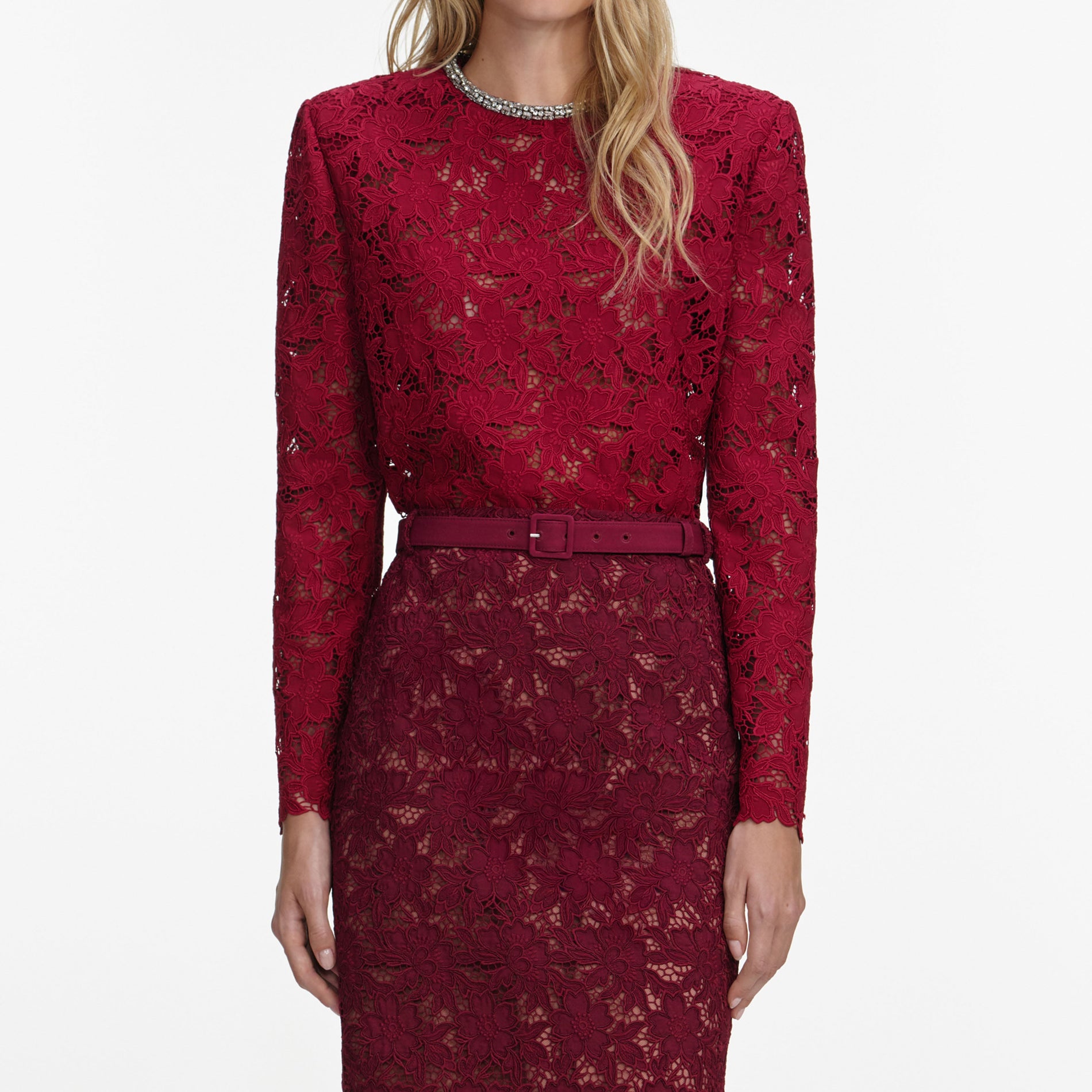 A close up of a woman wearing the Burgundy Guipure Lace Midi Skirt