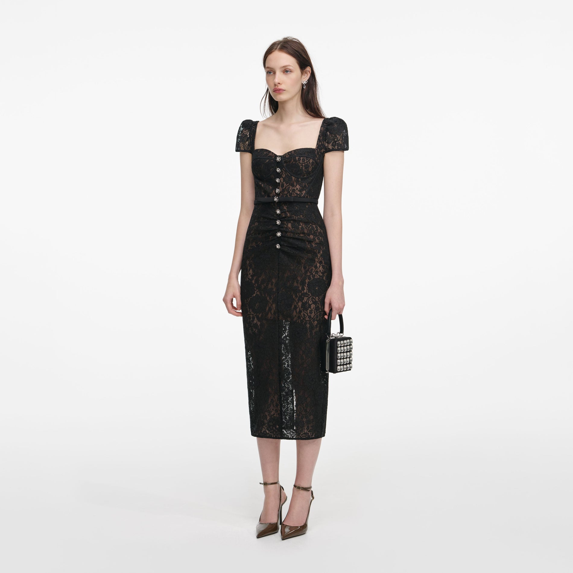 Side view of a woman wearing the Black Sweetheart Lace Midi Dress