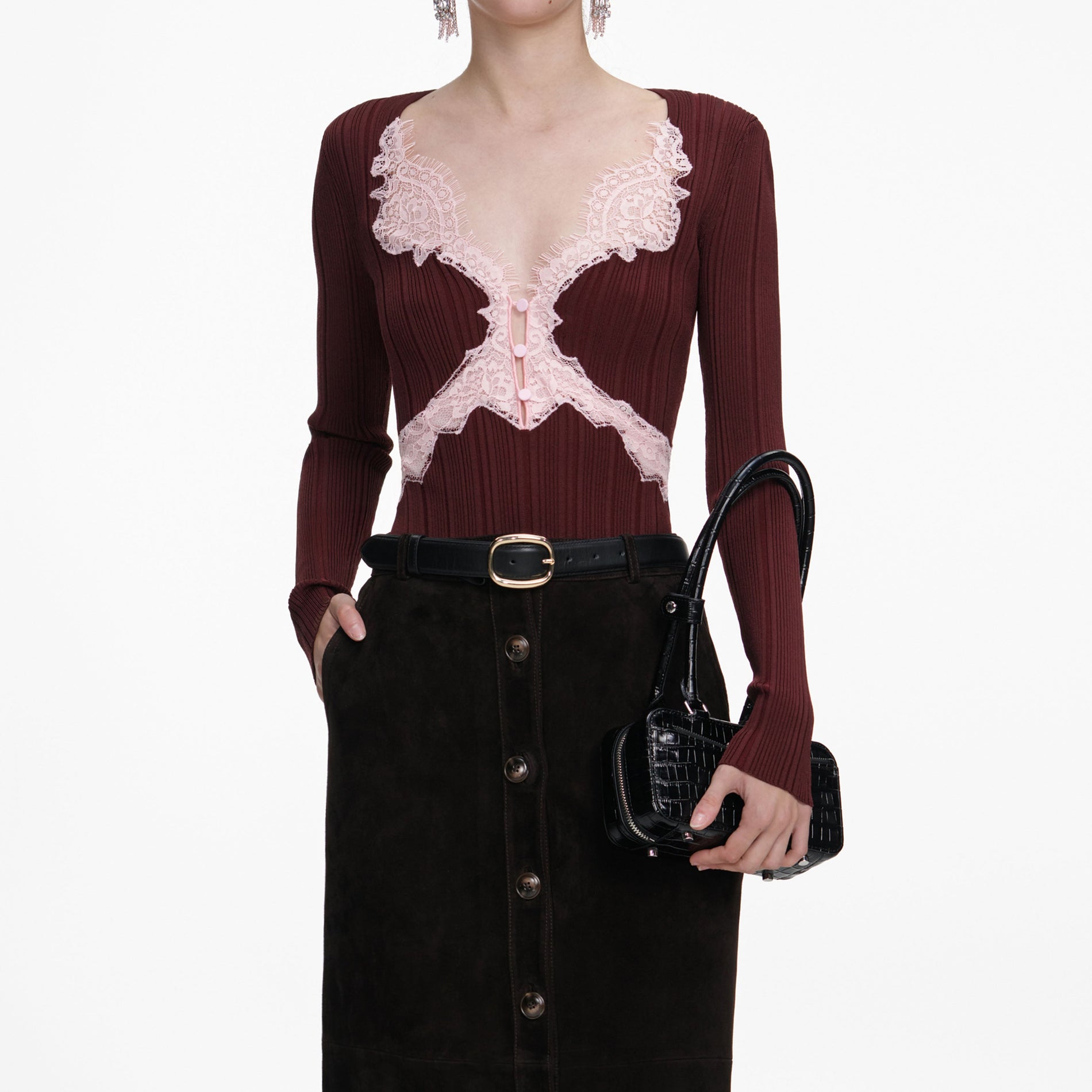 A close up of a woman wearing the Brown Contrast Lace Knit Top