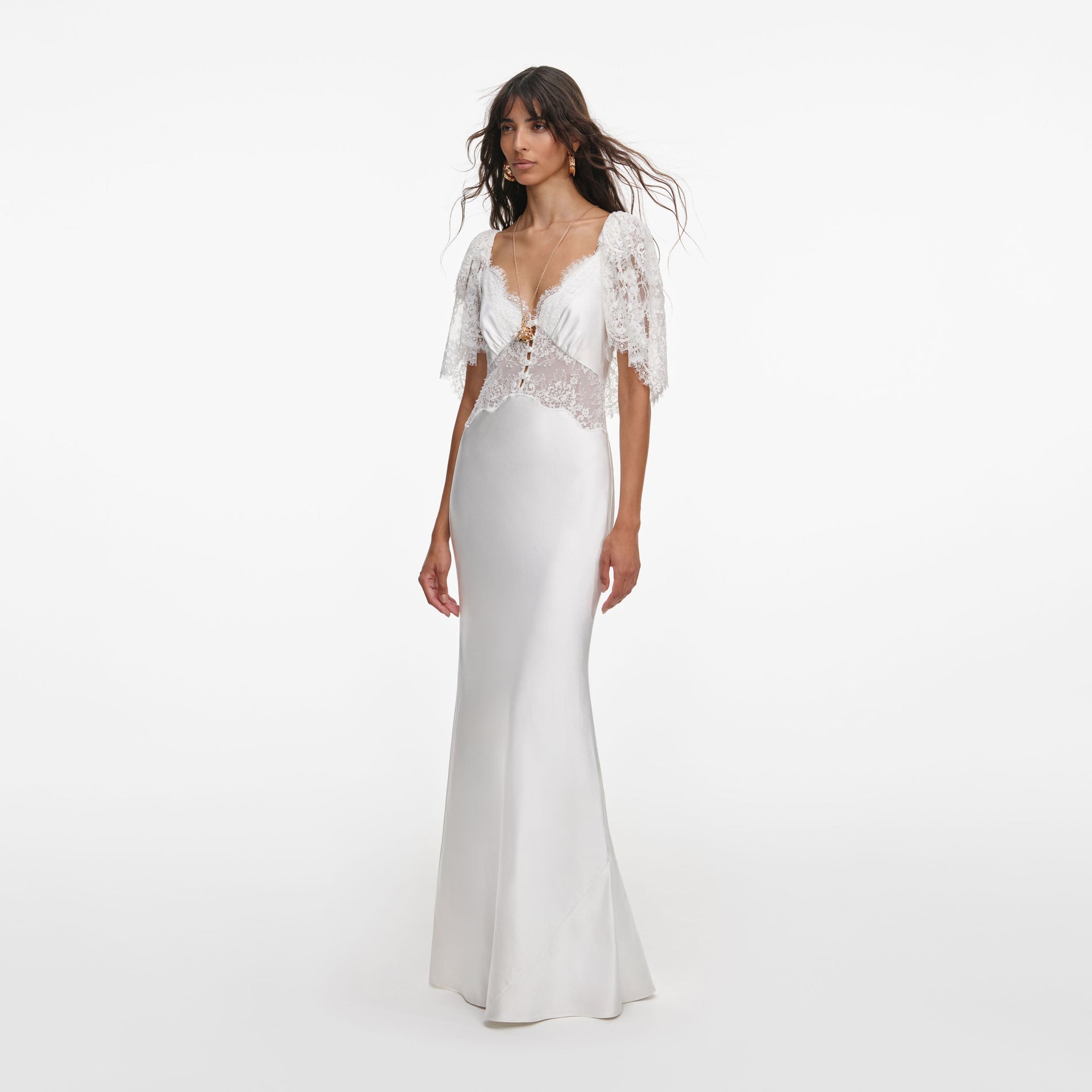 Side view of a woman wearing the White Fine Lace Satin Maxi Dress