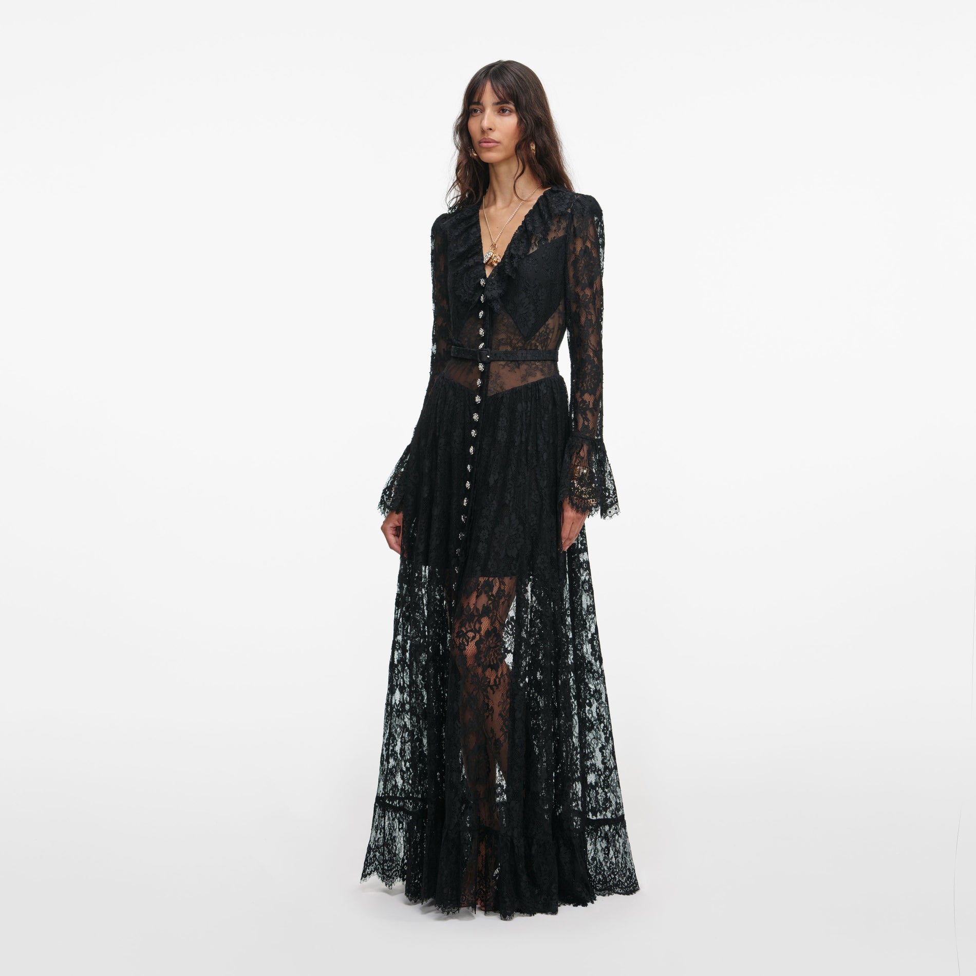 Side view of a woman wearing the Black Lace Ruffle Maxi Dress