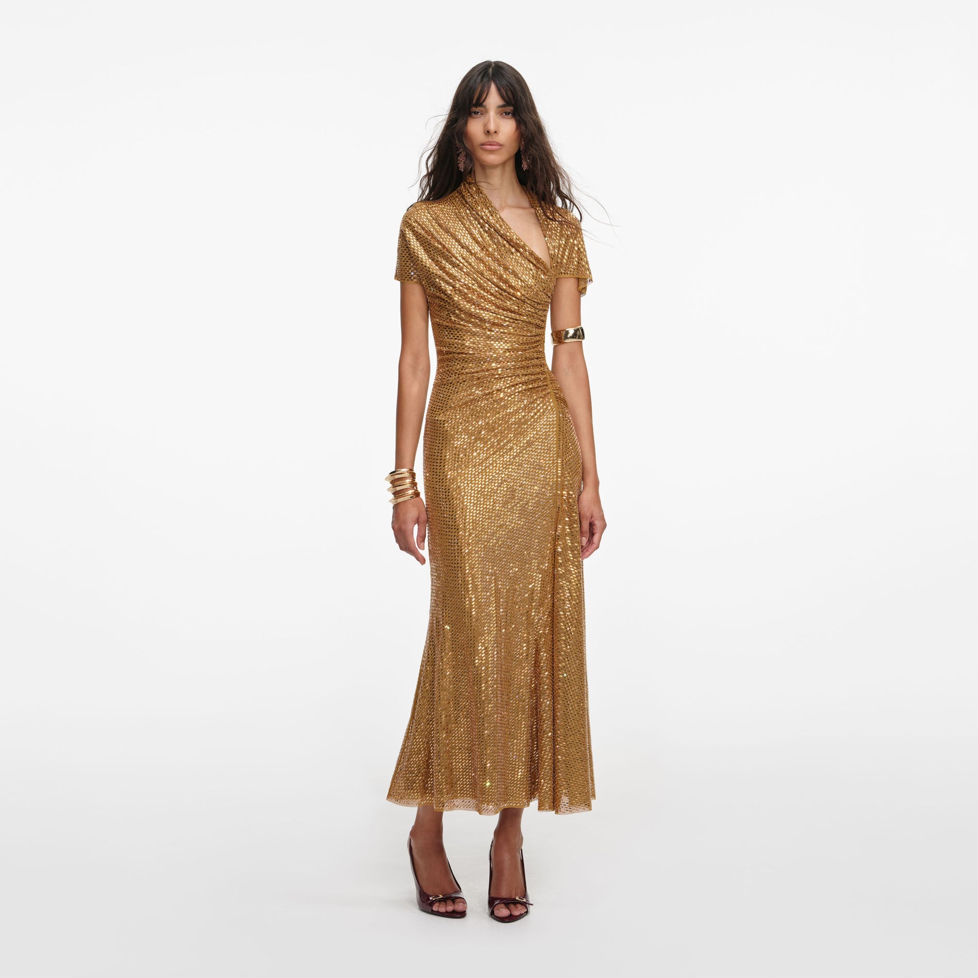 Front view of a woman wearing the Gold Rhinestone Drape Midi Dress