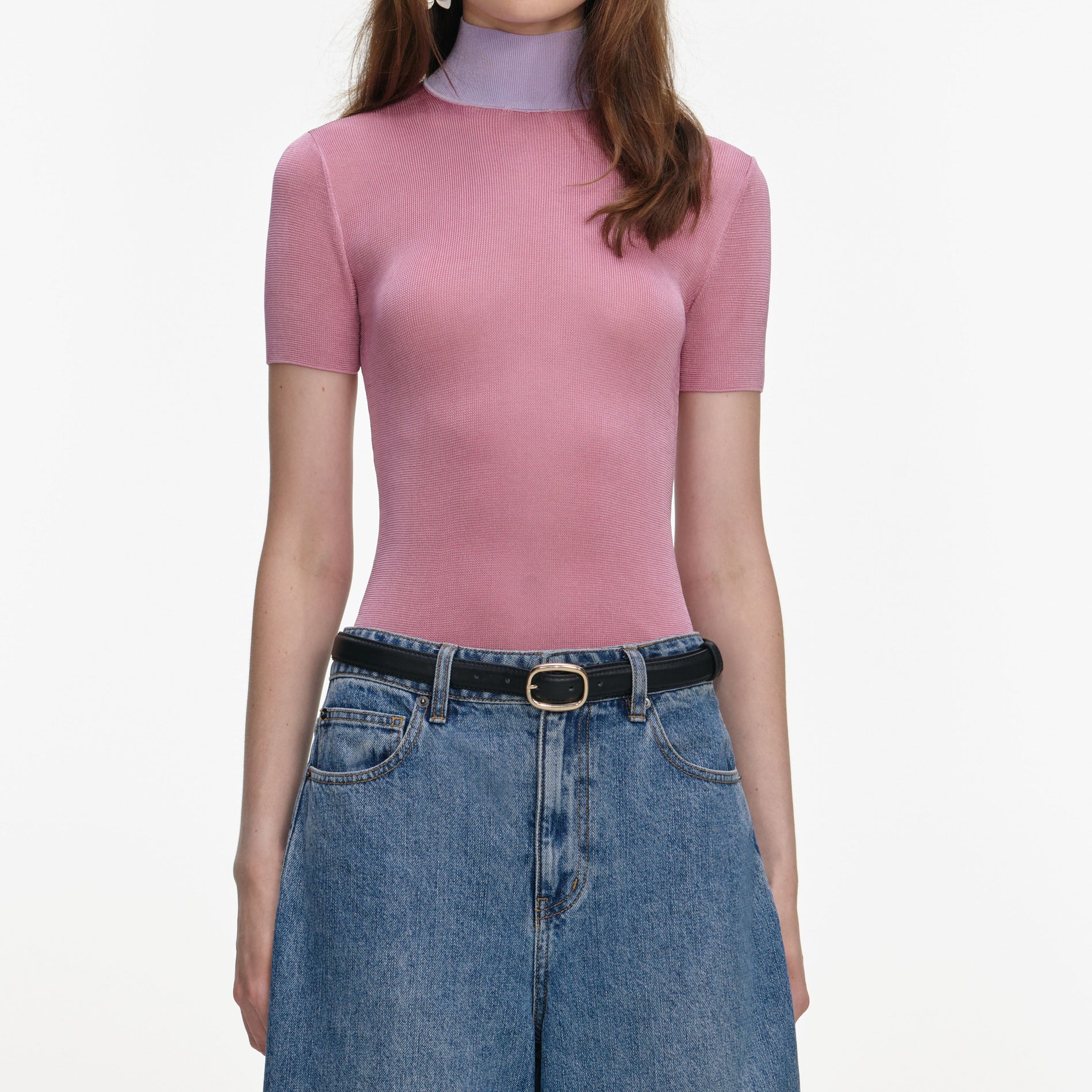 A close up of a woman wearing the Pink Short Sleeve Viscose Knit Top