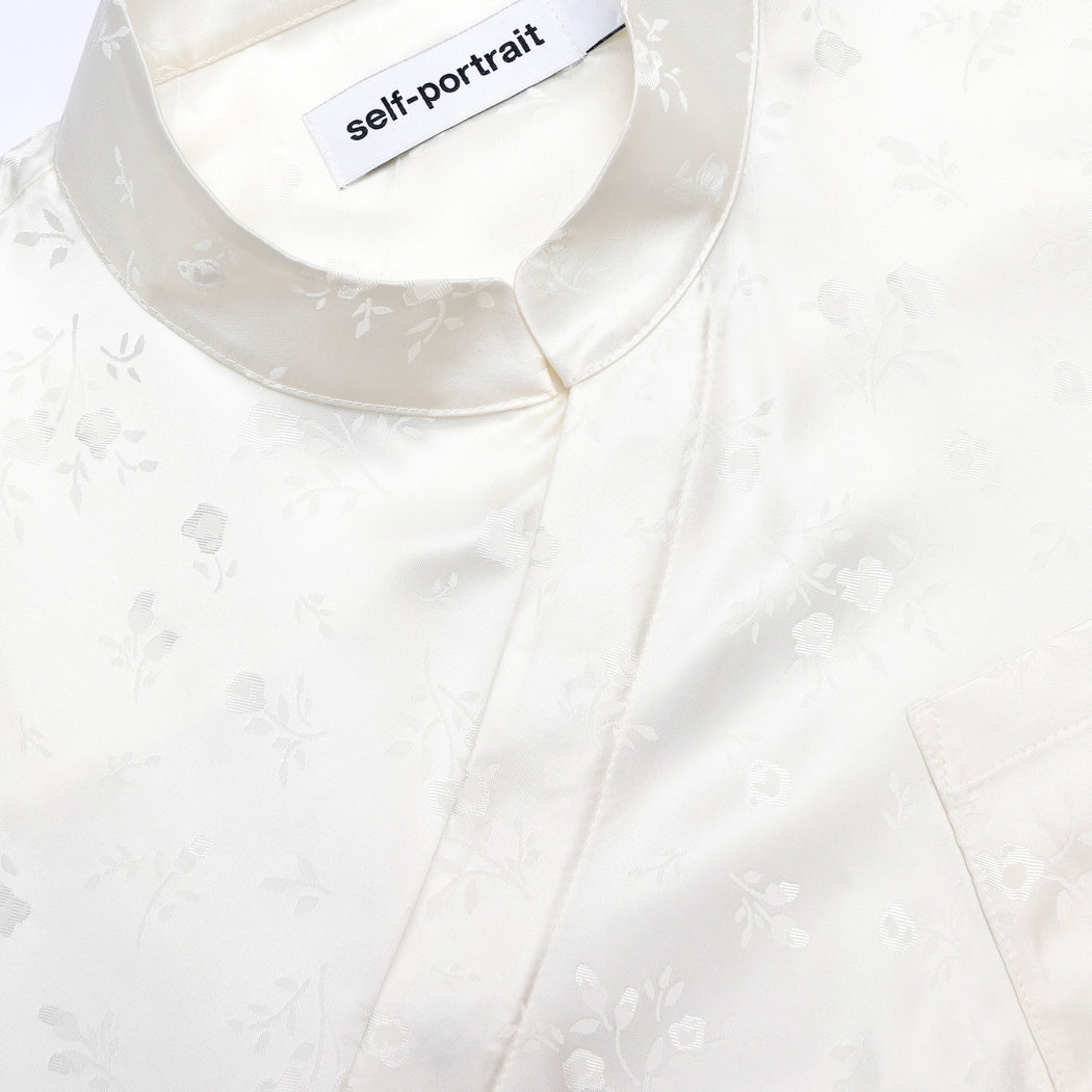 A close up of the fabric for the Cream Satin Jacquard Blouse