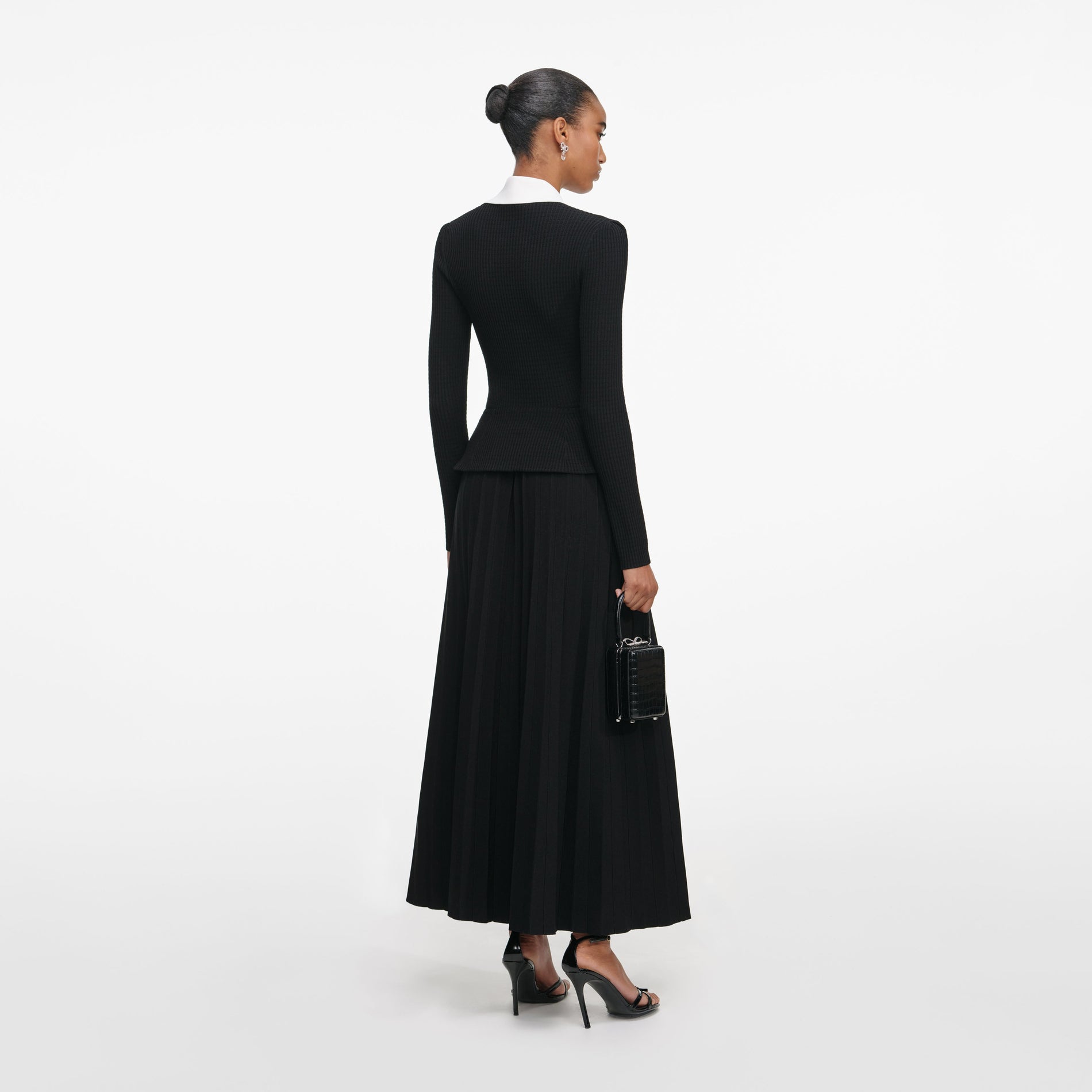 Back view of a woman wearing the Black Tailored Knit Midi Dress