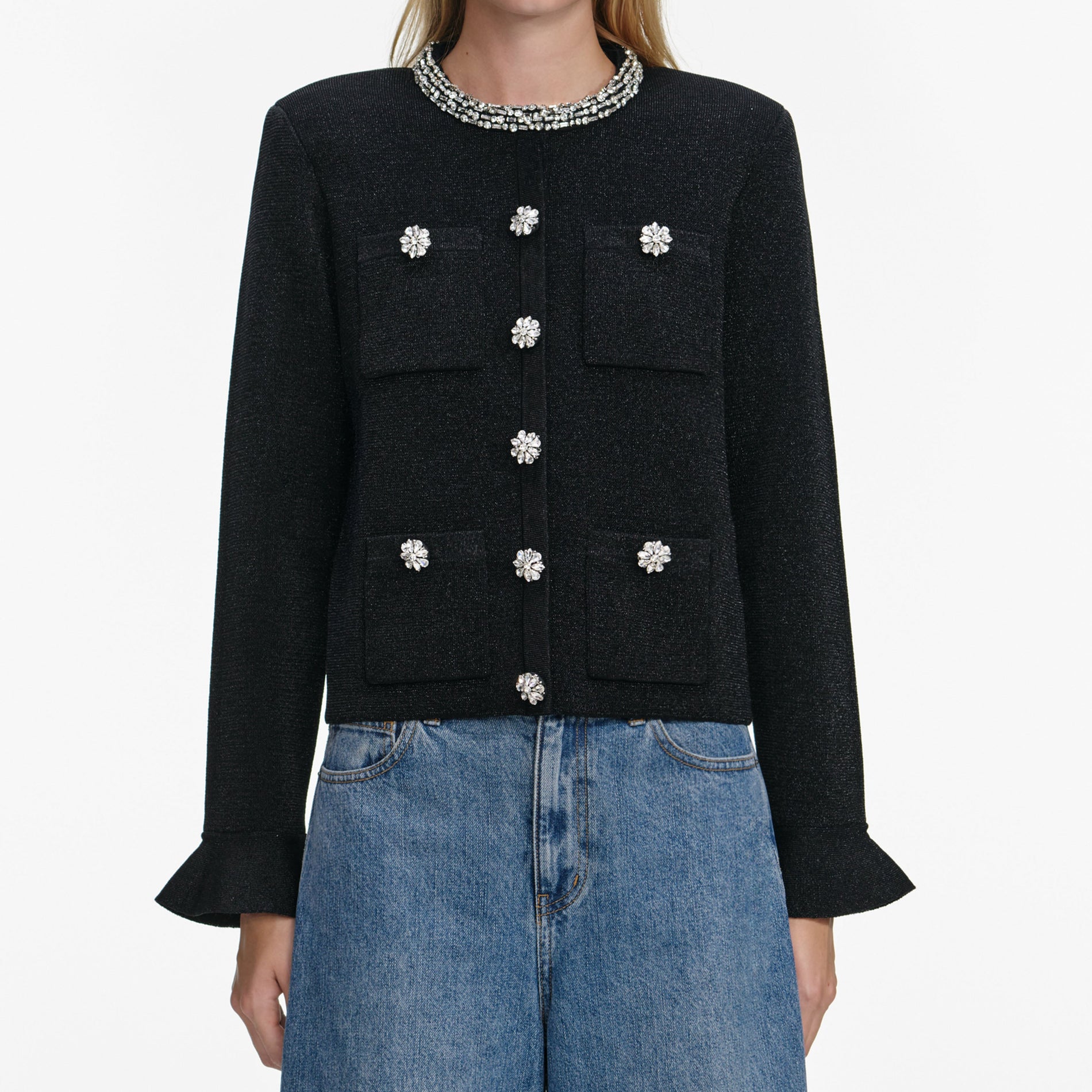 A close up of a woman wearing the Black Crystal Button Cardigan