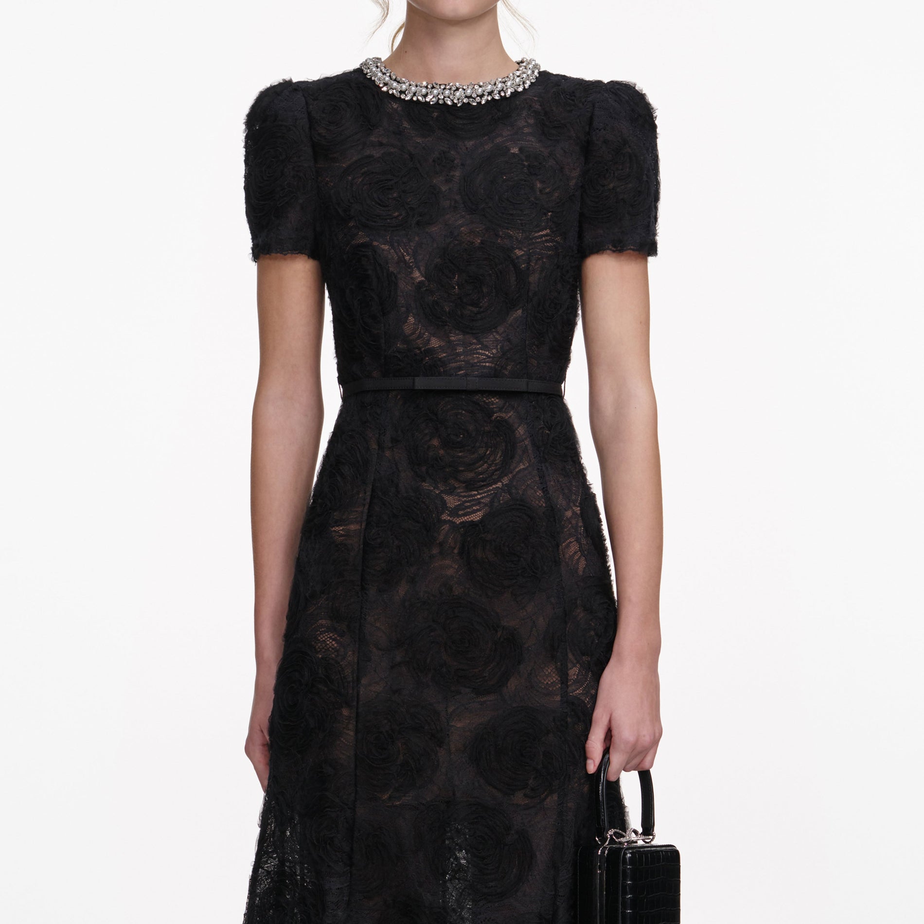 A close up of a woman wearing the Black Tulle Lace Midi Dress