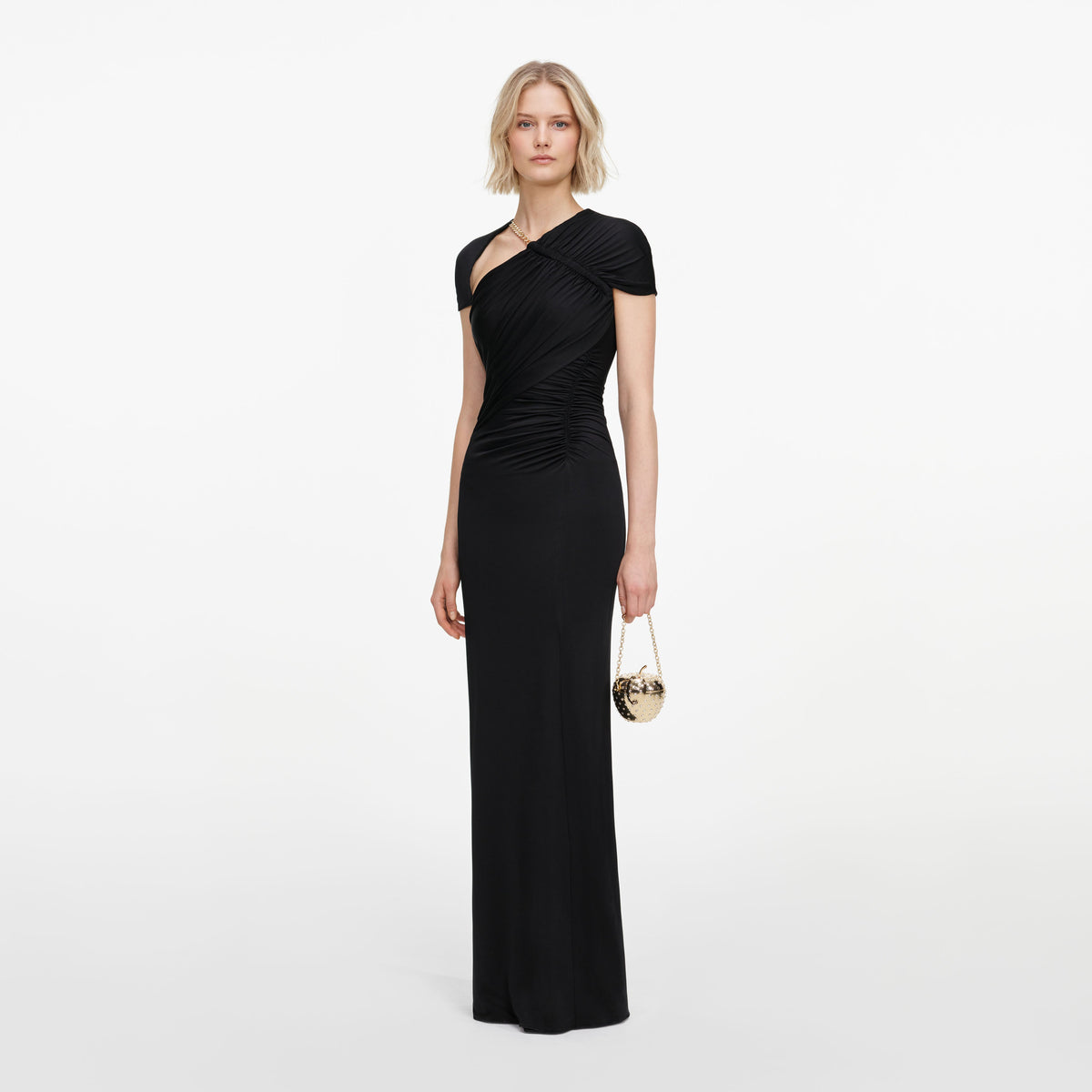 Side view of a woman wearing the Black Jersey Draped Maxi Dress