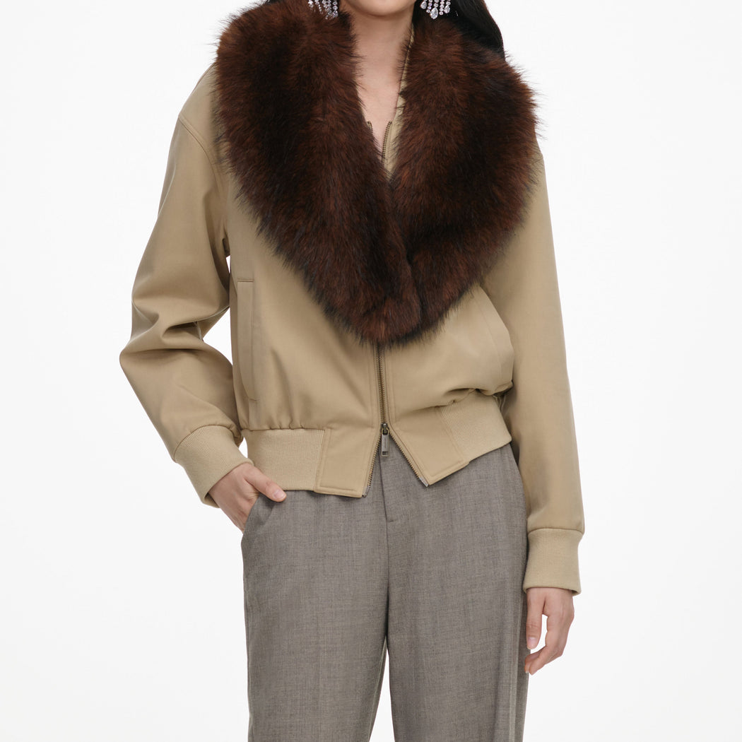A close up of the fabric for the Beige Faux Fur Bomber Jacket