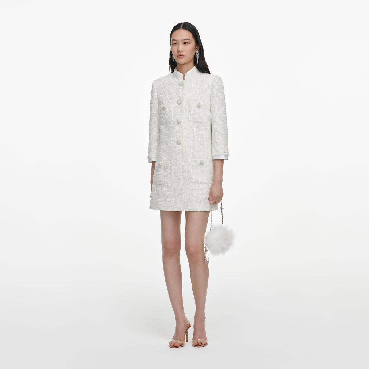 Side view of a woman wearing the Cream Boucle Mini Dress