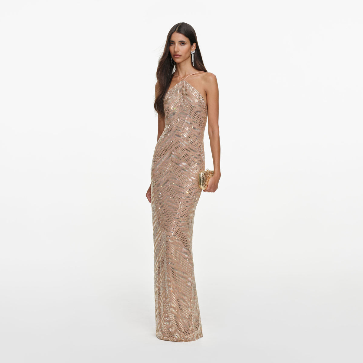 Side view of a woman wearing the Champagne Chevron Rhinestone Halterneck Maxi Dress