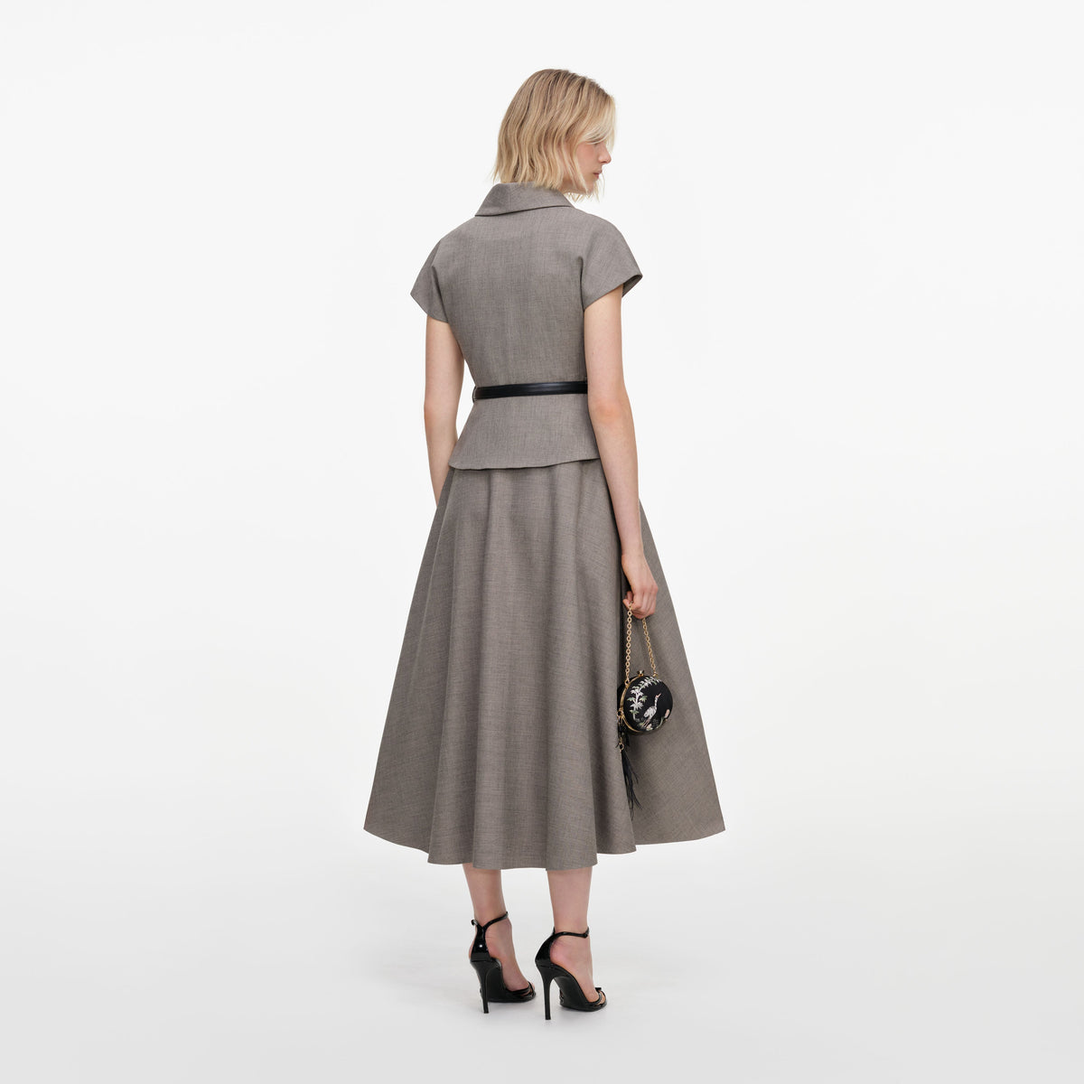 Back view of a woman wearing the Brown Twill Brooch Midi Dress