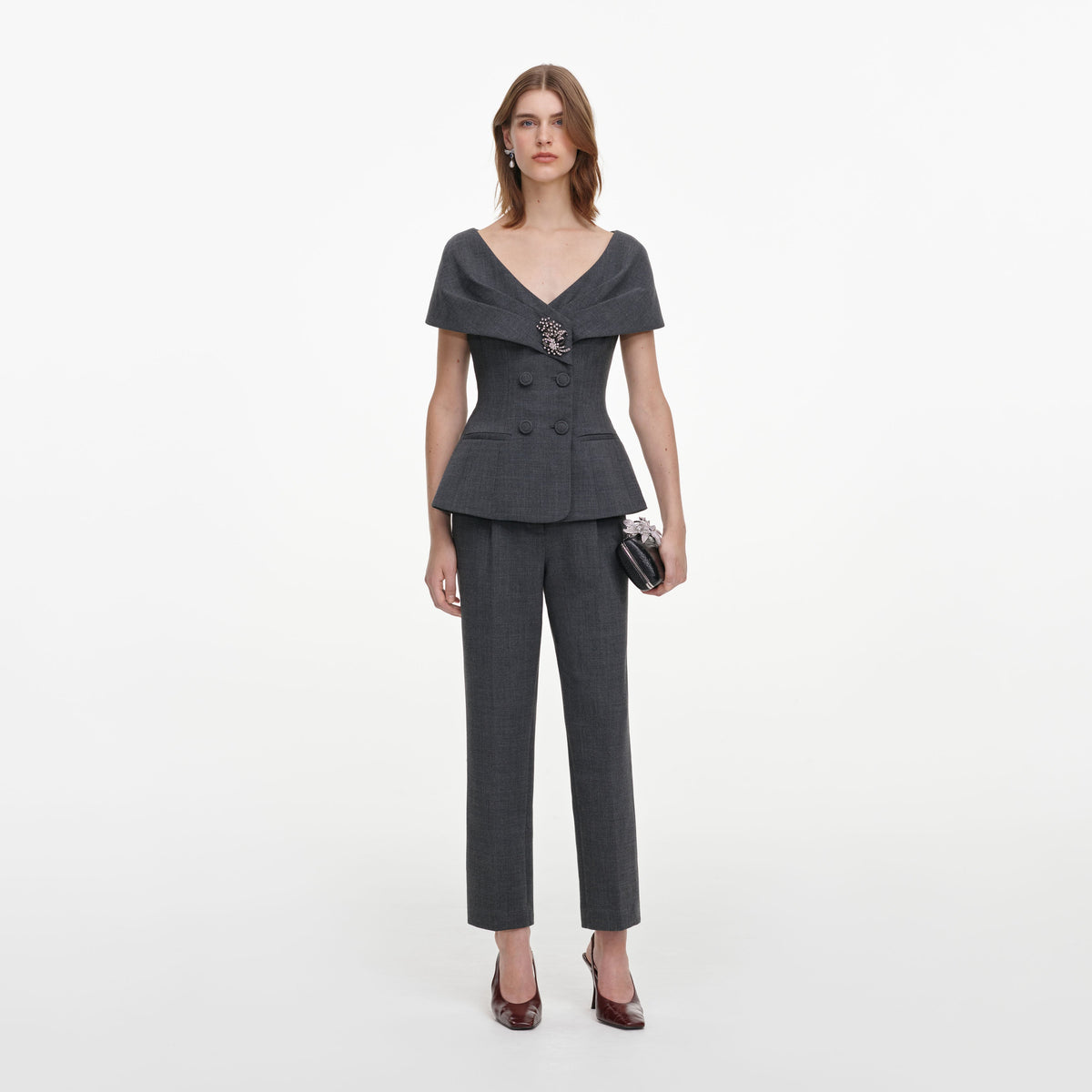 Front view of a woman wearing the Grey Tailored Brooch Jumpsuit