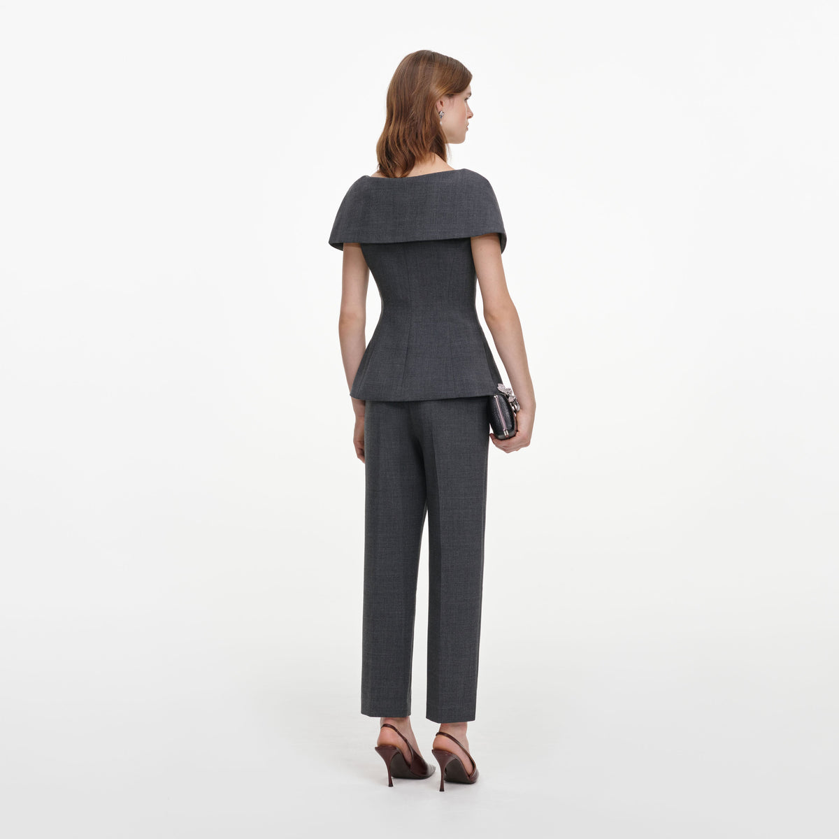Back view of a woman wearing the Grey Tailored Brooch Jumpsuit