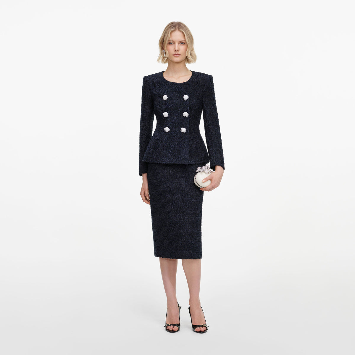 Front view of a woman wearing the Navy Boucle Midi Dress