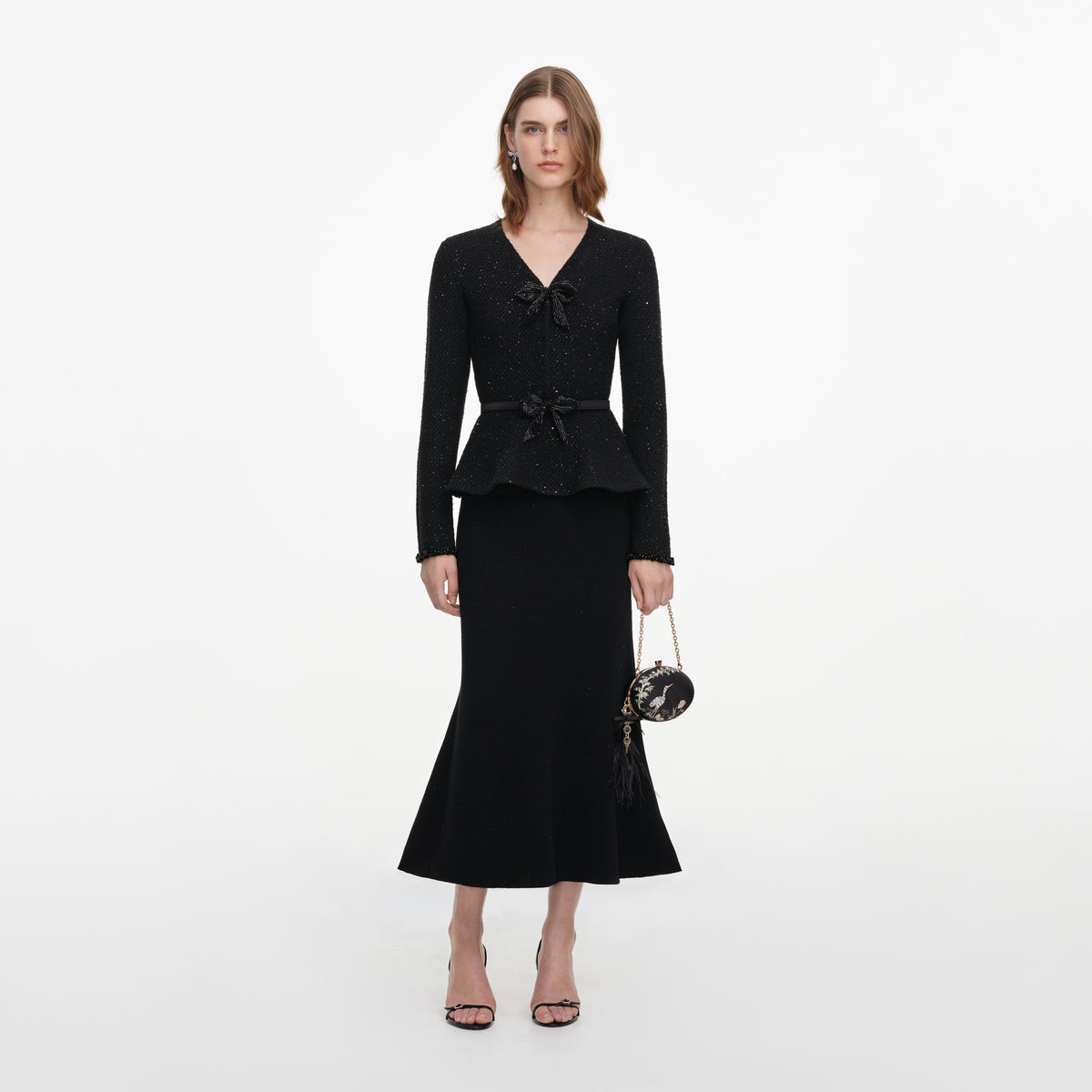 Front view of a woman wearing the Black Sequin Knit Midi Dress