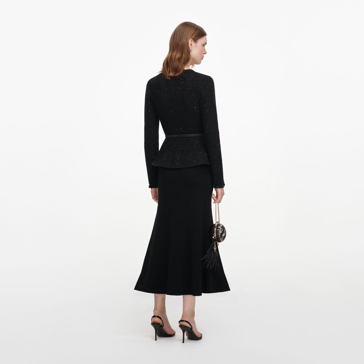 Back view of a woman wearing the Black Sequin Knit Midi Dress
