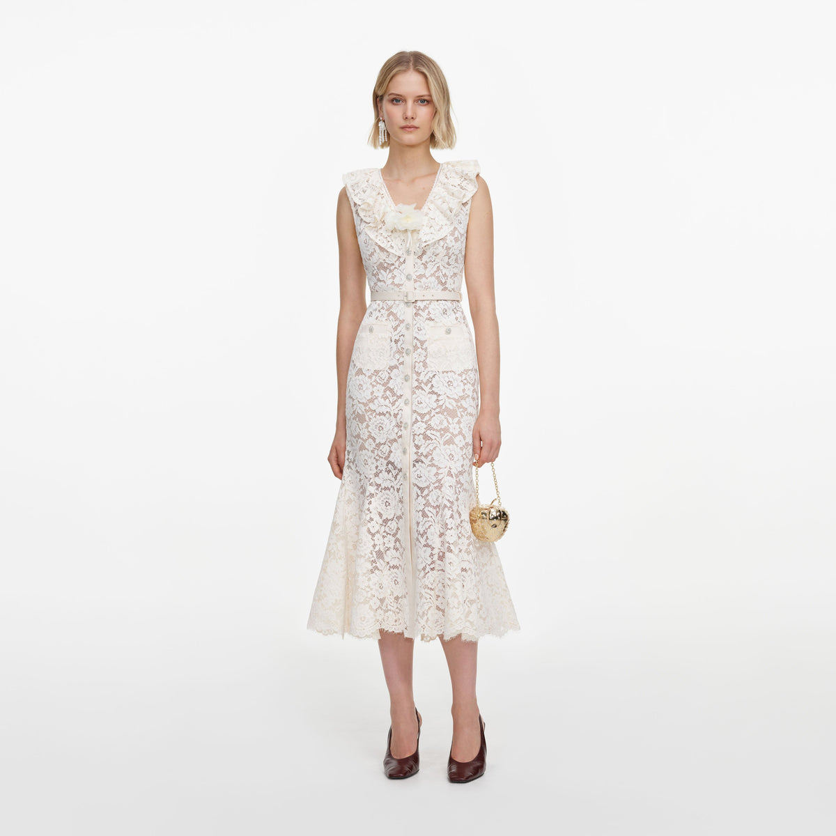 Front view of a woman wearing the Cream Lace Flower Midi Dress