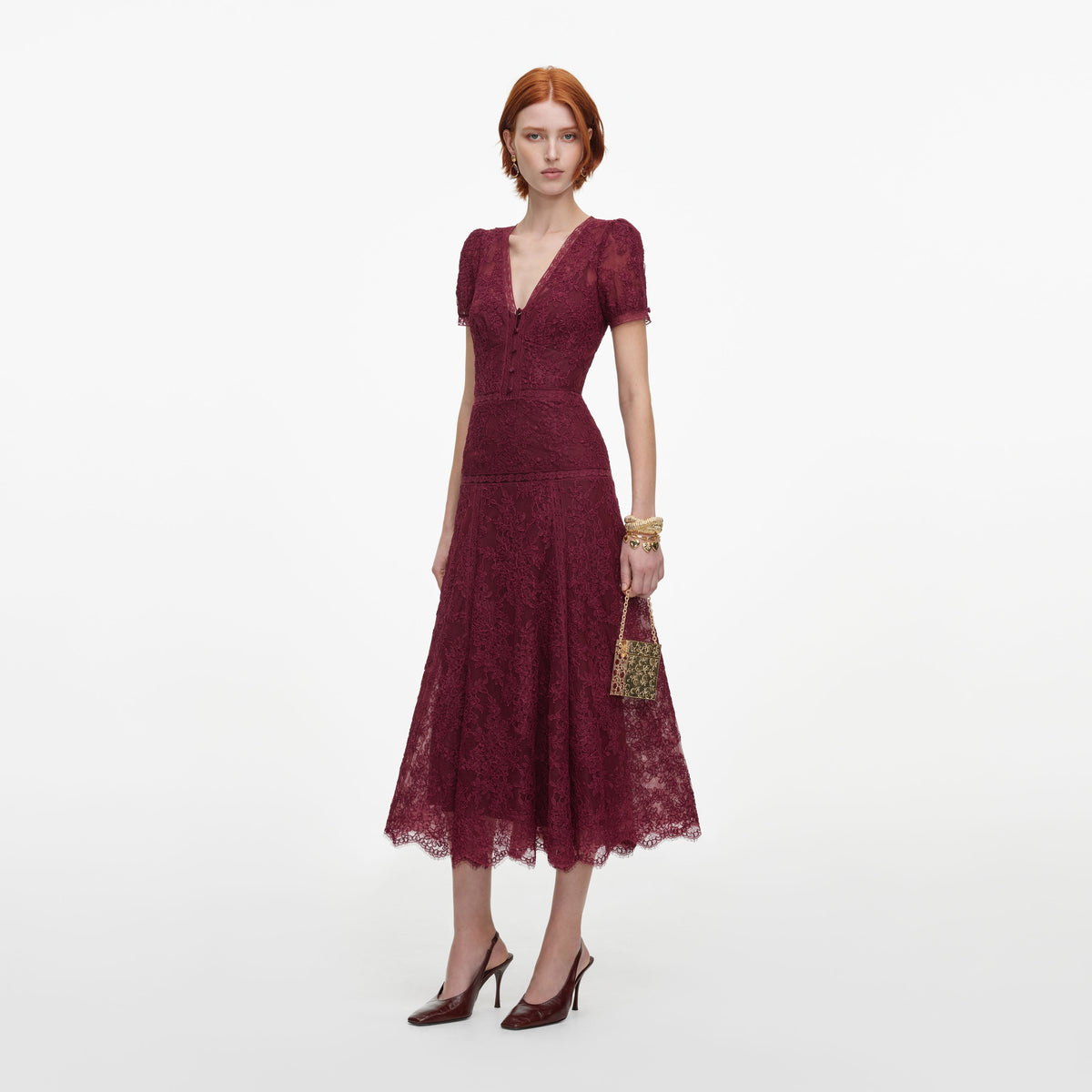 Side view of a woman wearing the Burgundy Lace Midi Dress